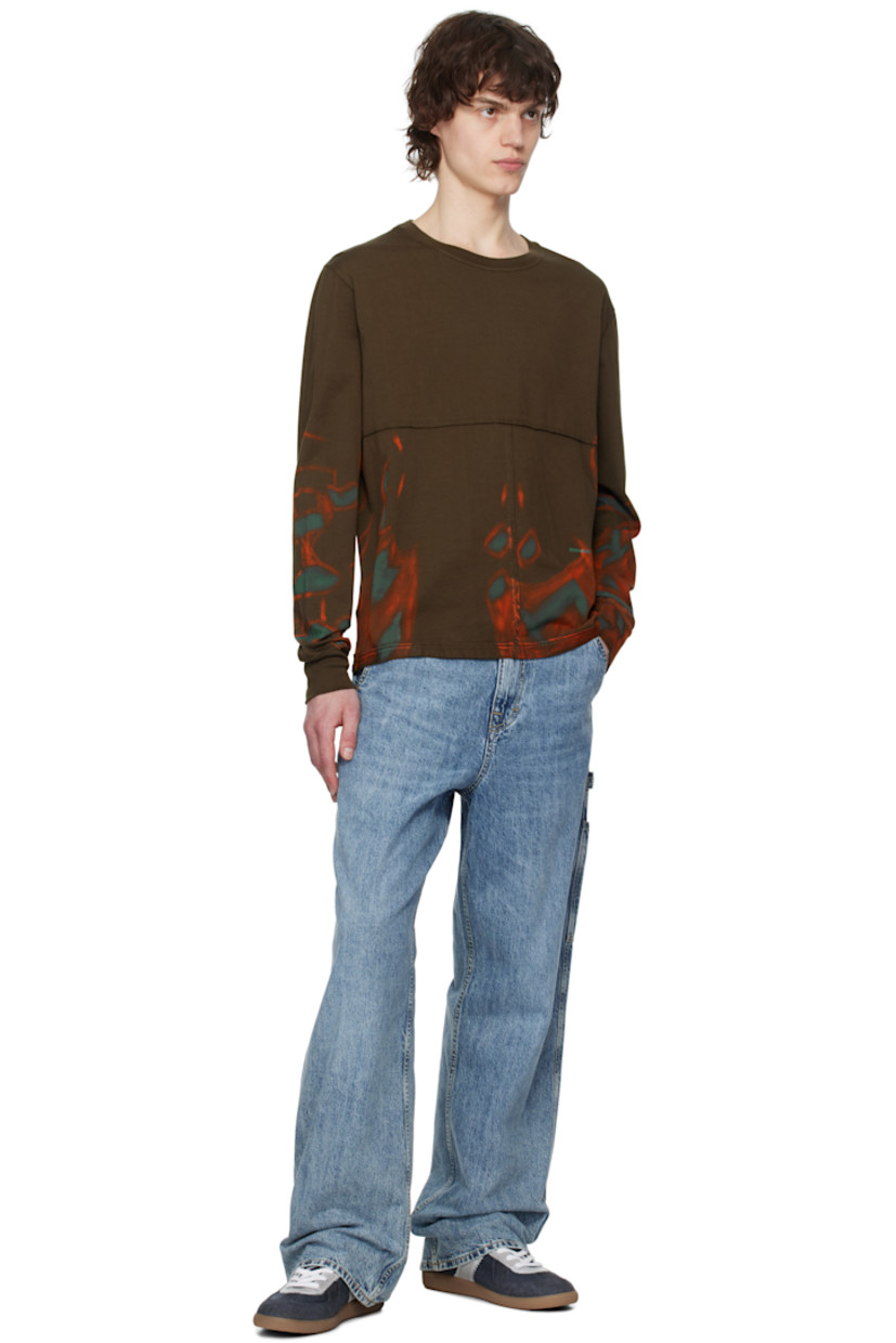 Cotton jersey T-shirt. Exposed seams with raw edges and graphic pattern throughout.

· Paneled construction
· Rib-knit crewneck
· Logo printed at front

Each item is unique. Please note that coloration may vary.

Supplier color: Oil
