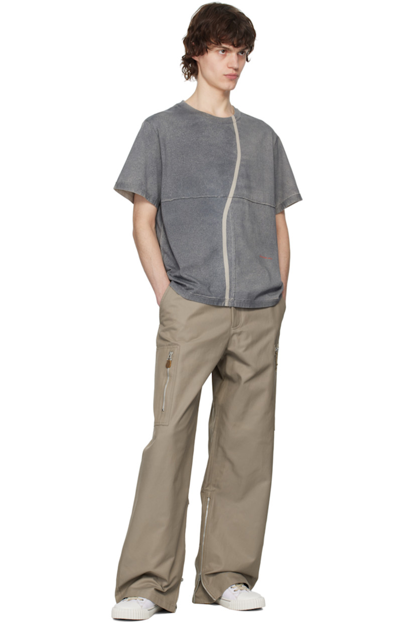 Garment-washed and spray-dyed cotton jersey T-shirt. Exposed seams with raw edges throughout.

· Paneled construction
· Rib-knit crewneck
· Stripe at front and back
· Logo printed at front

Each item is unique. Please note that coloration may vary.

Supplier color: Smog