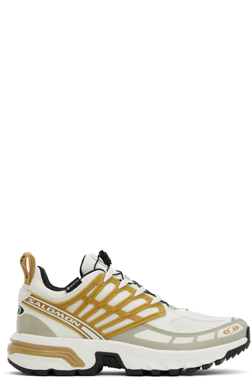 Low-top GORE-TEX™ SensiFit™ Kurim mesh and faux-leather sneakers in off-white.

· Waterproof
· Rubberized trim and printed logos throughout
· Quicklace™ closure
· Logo patch at padded tongue
· Padded collar
· Logo flag at outer side
· Logo-bonded pull-loops at heel tab
· OrthoLite® insole
· Jersey lining
· Agile Chassis™ System at rubber midsole
· Treaded All Terrain Contagrip® rubber sole

Supplier color: Icicle/Antelope/Tea
