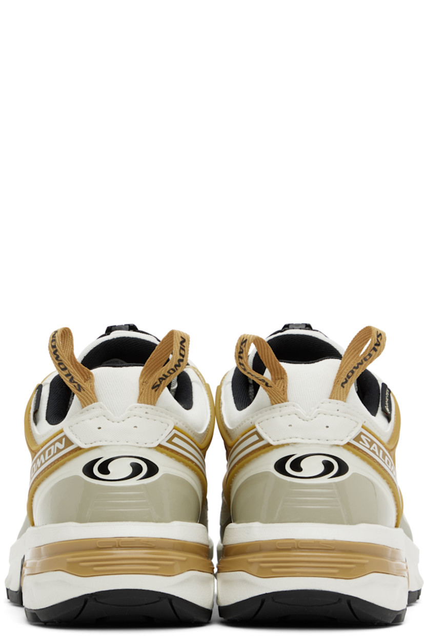 Low-top GORE-TEX™ SensiFit™ Kurim mesh and faux-leather sneakers in off-white.

· Waterproof
· Rubberized trim and printed logos throughout
· Quicklace™ closure
· Logo patch at padded tongue
· Padded collar
· Logo flag at outer side
· Logo-bonded pull-loops at heel tab
· OrthoLite® insole
· Jersey lining
· Agile Chassis™ System at rubber midsole
· Treaded All Terrain Contagrip® rubber sole

Supplier color: Icicle/Antelope/Tea