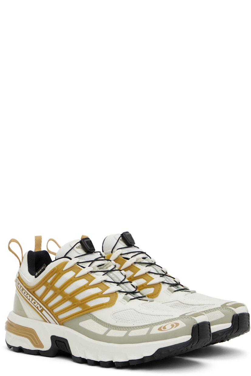 Low-top GORE-TEX™ SensiFit™ Kurim mesh and faux-leather sneakers in off-white.

· Waterproof
· Rubberized trim and printed logos throughout
· Quicklace™ closure
· Logo patch at padded tongue
· Padded collar
· Logo flag at outer side
· Logo-bonded pull-loops at heel tab
· OrthoLite® insole
· Jersey lining
· Agile Chassis™ System at rubber midsole
· Treaded All Terrain Contagrip® rubber sole

Supplier color: Icicle/Antelope/Tea
