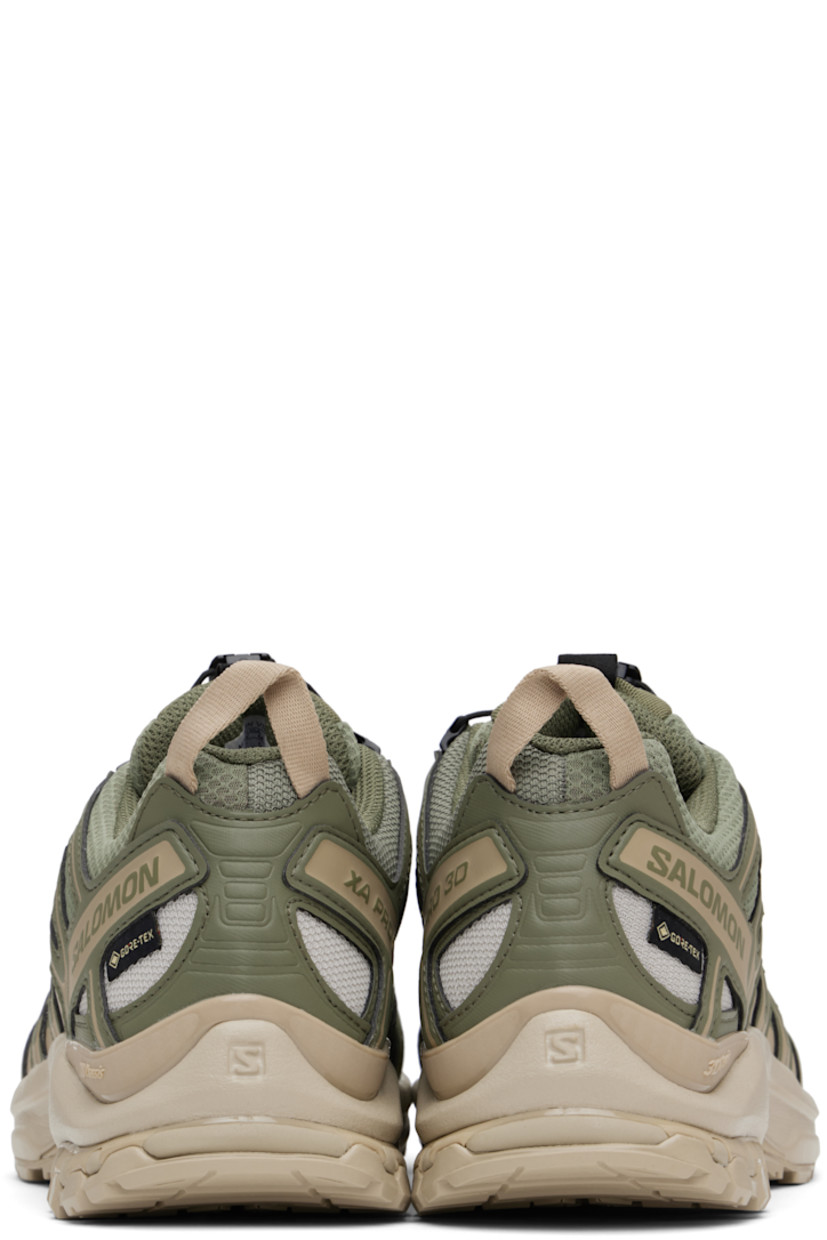 Low-top GORE-TEX® sensiFIT™ mesh and textured faux-leather sneakers in khaki.

· Waterproof
· Quicklace™ closure
· Logo-woven pull-loop at tongue
· Padded tongue and collar
· Reflective trim and logo printed at outer side
· Pull-loop at heel tab
· Logo embossed at heel
· Molded OrthoLite® footbed
· 3D Advanced Chassis™ foam rubber midsole
· Treaded All Terrain Contagrip® rubber outsole

Supplier color: Deep lichen green/White pepper/Silver Cloud