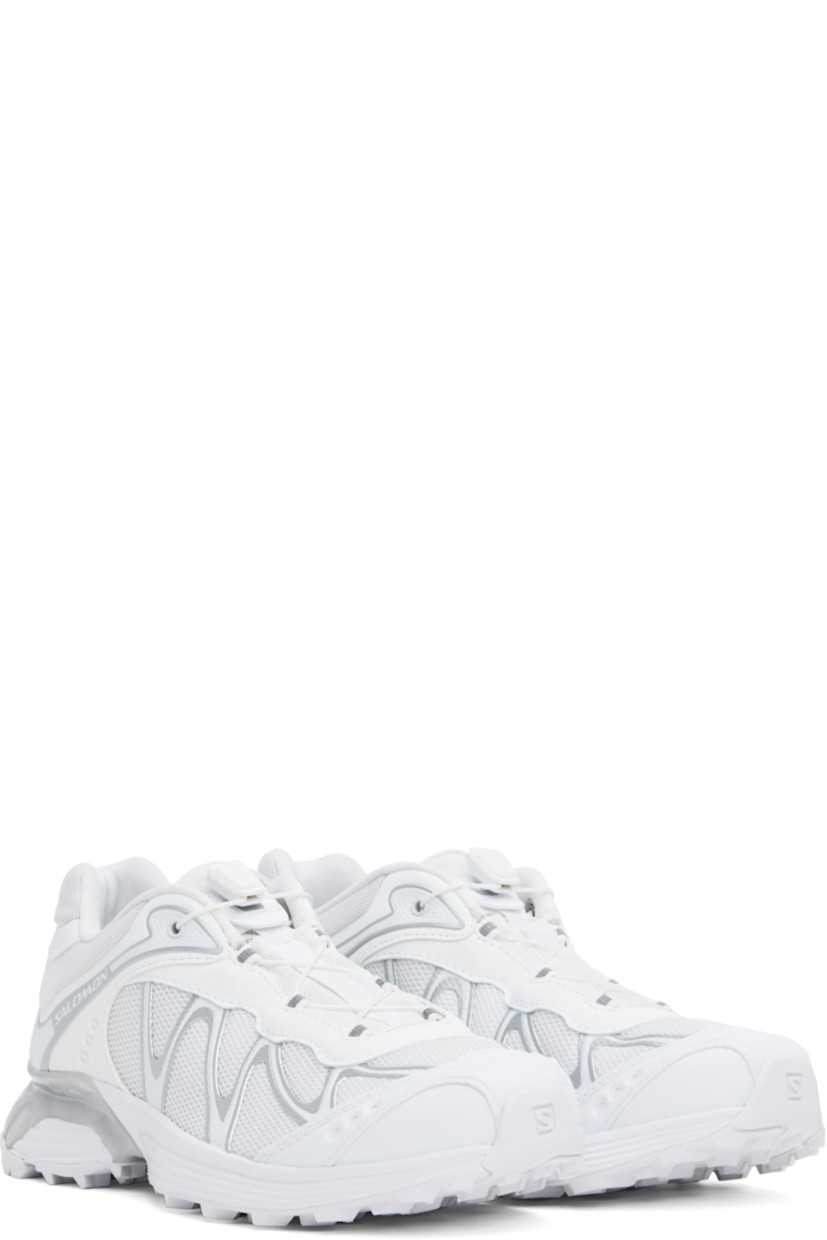 Low-top mesh and faux-nubuck sneakers in white.

· Reflective trim throughout
· Logo embossed at toe
· Quicklace™ closure
· Logo patch at padded tongue
· Padded collar
· Sensifit™ panel at sides
· Logo printed at outer side and heel tab
· Molded OrthoLite® insole
· Mesh lining
· Foam rubber EnergyCell midsole 
· Agile Chassis™ System at midsole
· Treaded Mud Contagrip® rubber sole

Supplier color: White/Lunar rock/Ftw silver