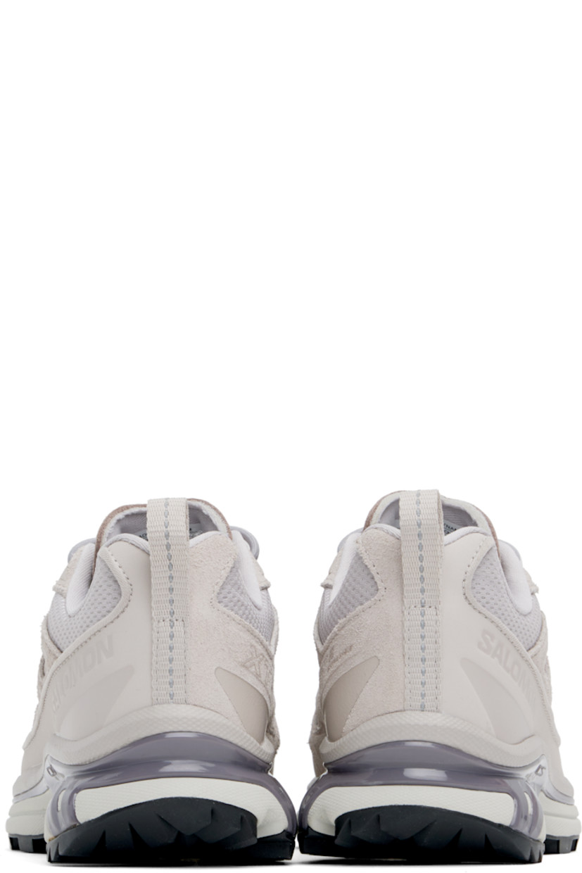 Low-top suede, grained leather, and mesh sneakers in taupe.

· Piping throughout
· Cap toe
· Lace-up closure
· Logo printed at tongue and outer side
· Padded tongue and collar
· SensiFit™ panel at sides
· Pull-loop with reflective trim at heel tab
· Molded OrthoLite® footbed
· Jersey lining
· Foam rubber EnergyCell midsole 
· Agile Chassis™ System at midsole
· Treaded Mud Contagrip® rubber sole

Supplier color: Ashes of roses/Ashes of roses/Excalibur