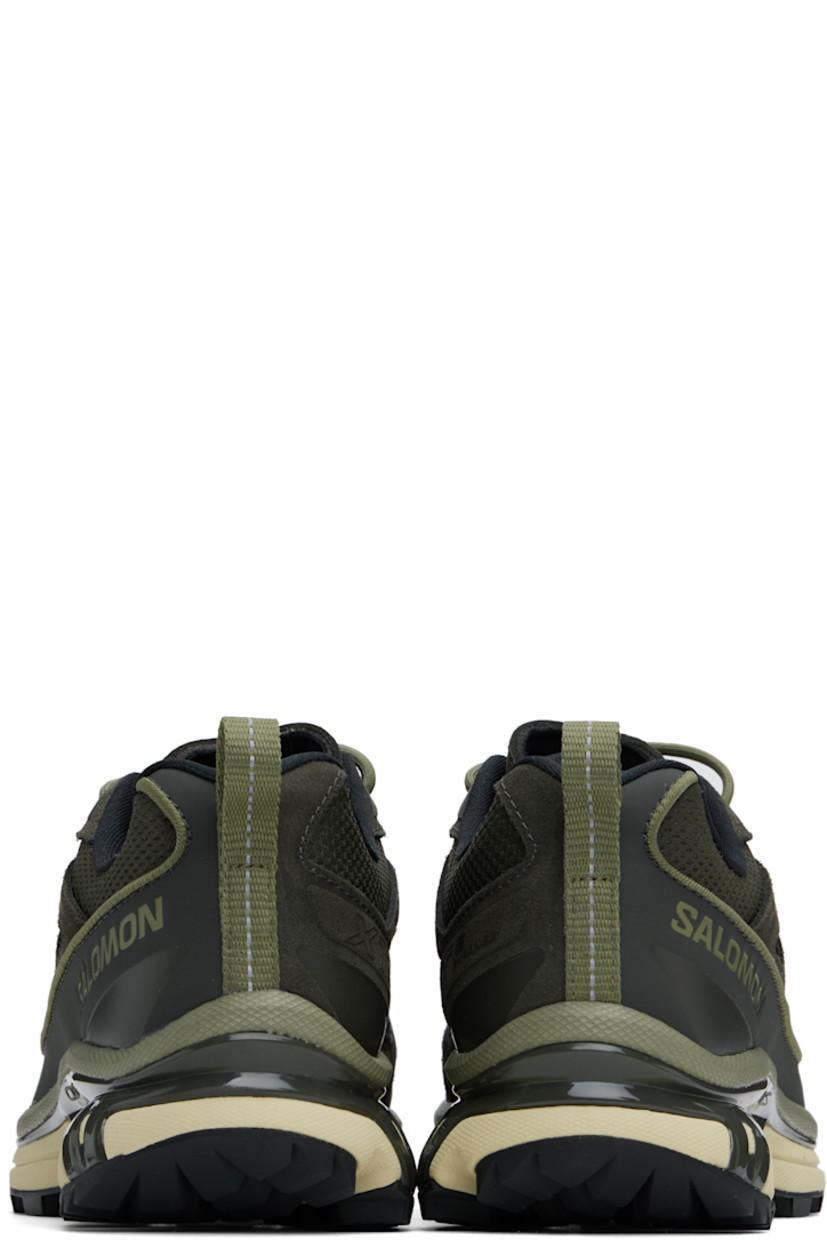Low-top suede, grained leather, and mesh sneakers in khaki.

· Piping throughout
· Cap toe
· Lace-up closure
· Logo printed at tongue and outer side
· Padded tongue and collar
· SensiFit™ panel at sides
· Pull-loop with reflective trim at heel tab
· Molded OrthoLite® footbed
· Jersey lining
· Foam rubber EnergyCell midsole 
· Agile Chassis™ System at midsole
· Treaded Mud Contagrip® rubber sole

Supplier color: Peat/Deep lichen green/Green haze