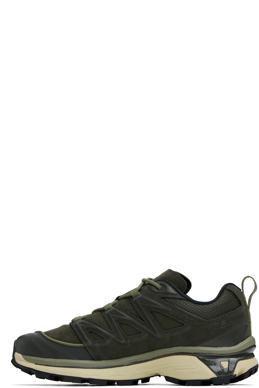 Low-top suede, grained leather, and mesh sneakers in khaki.

· Piping throughout
· Cap toe
· Lace-up closure
· Logo printed at tongue and outer side
· Padded tongue and collar
· SensiFit™ panel at sides
· Pull-loop with reflective trim at heel tab
· Molded OrthoLite® footbed
· Jersey lining
· Foam rubber EnergyCell midsole 
· Agile Chassis�™ System at midsole
· Treaded Mud Contagrip® rubber sole

Supplier color: Peat/Deep lichen green/Green haze