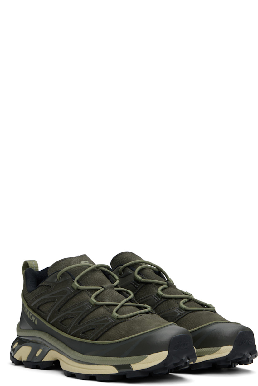 Low-top suede, grained leather, and mesh sneakers in khaki.

· Piping throughout
· Cap toe
· Lace-up closure
· Logo printed at tongue and outer side
· Padded tongue and collar
· SensiFit™ panel at sides
· Pull-loop with reflective trim at heel tab
· Molded OrthoLite® footbed
· Jersey lining
· Foam rubber EnergyCell midsole 
· Agile Chassis™ System at midsole
· Treaded Mud Contagrip® rubber sole

Supplier color: Peat/Deep lichen green/Green haze