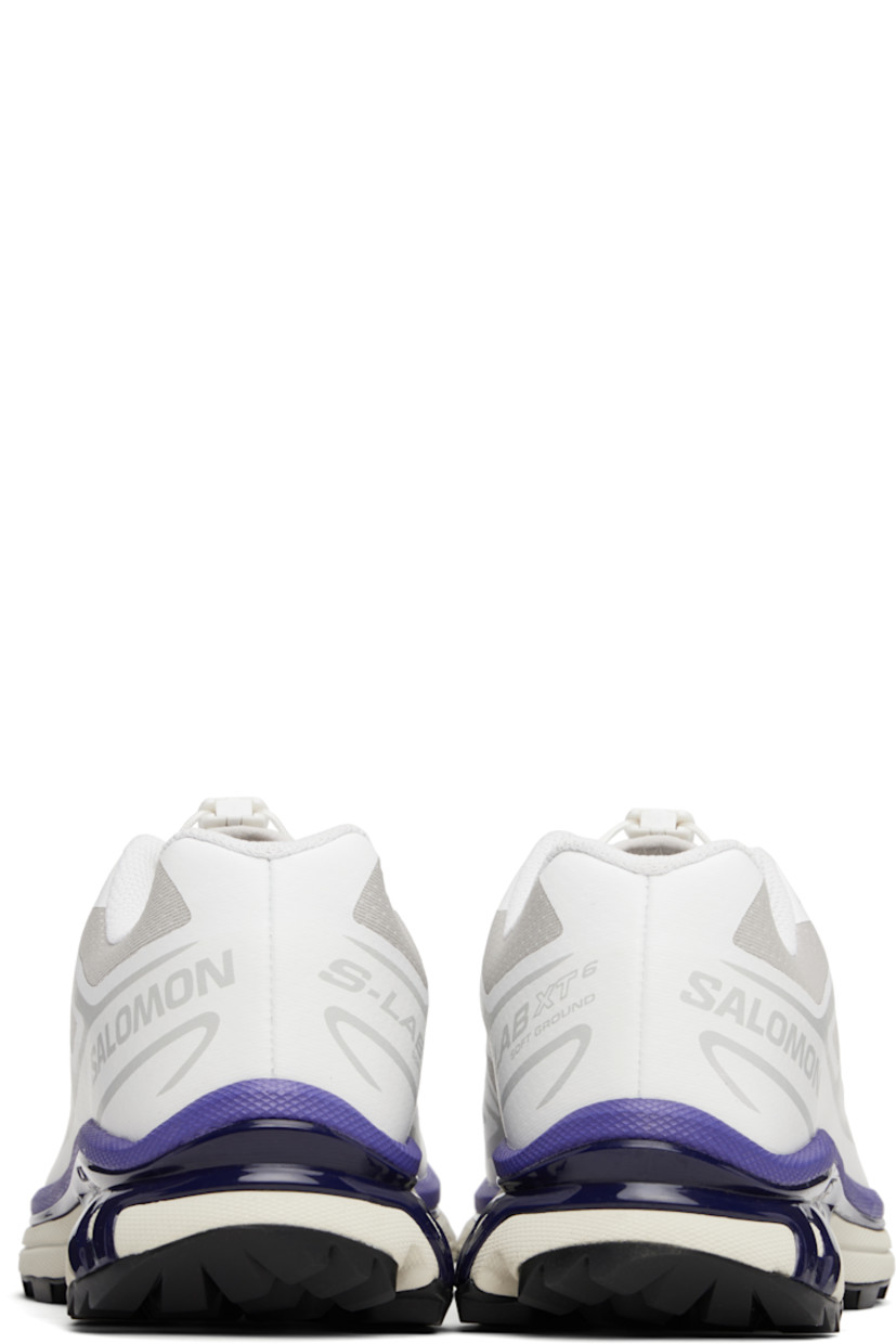 Low-top lightweight mesh sneakers in white and gray.

· Bonded trim throughout
· Logo embossed at toe
· Quicklace™ closure
· Logo patch at vamp
· Logo-woven pull-loop at padded tongue
· Padded collar
· Bonded sensiFIT™ panel at sides
· Logo printed at outer side
· Text printed at inner side
· Molded OrthoLite® insole
· EndoFit™ mesh lining
· Agile Chassis™ System at EnergyCell midsole
· Treaded Mud Contagrip® rubber sole

Supplier color: White/Lunar rock/Liberty