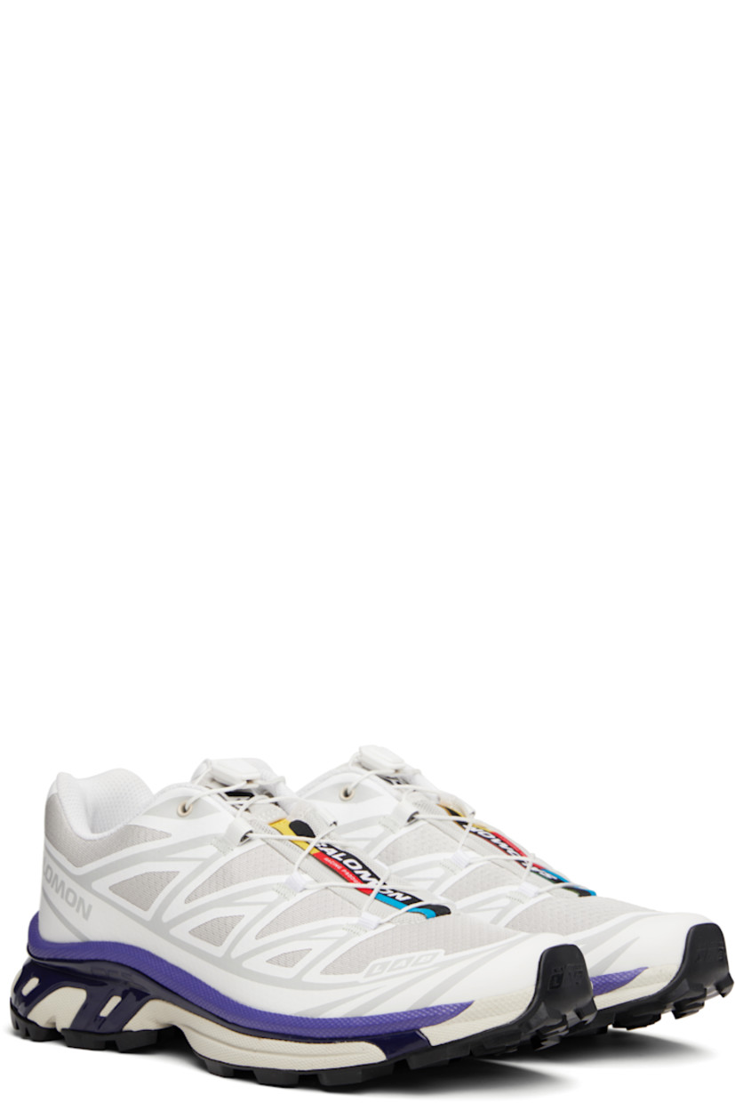 Low-top lightweight mesh sneakers in white and gray.

· Bonded trim throughout
· Logo embossed at toe
· Quicklace™ closure
· Logo patch at vamp
· Logo-woven pull-loop at padded tongue
· Padded collar
· Bonded sensiFIT™ panel at sides
· Logo printed at outer side
· Text printed at inner side
· Molded OrthoLite® insole
· EndoFit™ mesh lining
· Agile Chassis™ System at EnergyCell midsole
· Treaded Mud Contagrip® rubber sole

Supplier color: White/Lunar rock/Liberty
