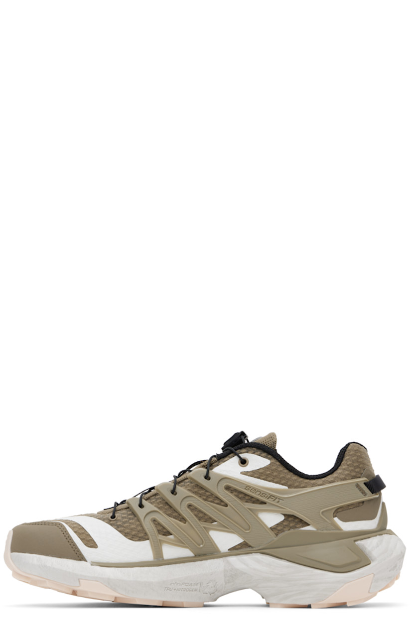 Low-top mesh sneakers in khaki.

· Bonded trim throughout
· Quicklace™ closure
· Logo patch at padded tongue
· Padded collar
· Logo embossed at outer side
· SensiFit™ panel at sides
· Pull-loop at heel tab
· EndoFit™ mesh lining
· infiniFOAM rubber midsole
· Treaded All Terrain Contagrip® rubber sole
· Advanced Chassis™ System at sole

Supplier color: Fallen rock/Stone gray/Vanilla ice