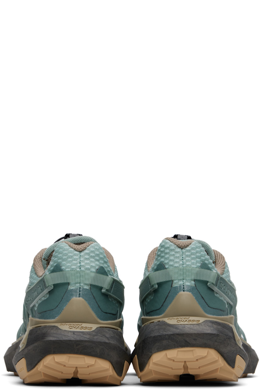 Low-top mesh sneakers in green.

· Bonded trim throughout
· Quicklace™ closure
· Logo patch at padded tongue
· Padded collar
· Logo embossed at outer side
· Rubber sensiFIT™ panel at sides
· Pull-loop at heel counter
· Molded OrthoLite® footbed
· EndoFit™ mesh lining
· infiniFOAM rubber midsole
· Treaded All Terrain Contagrip® rubber sole
· Advanced Chassis™ System at sole

Supplier color: North Atlantic/Black/Stone gray