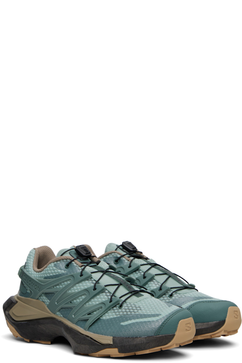 Low-top mesh sneakers in green.

· Bonded trim throughout
· Quicklace™ closure
· Logo patch at padded tongue
· Padded collar
· Logo embossed at outer side
· Rubber sensiFIT™ panel at sides
· Pull-loop at heel counter
· Molded OrthoLite® footbed
· EndoFit™ mesh lining
· infiniFOAM rubber midsole
· Treaded All Terrain Contagrip® rubber sole
· Advanced Chassis™ System at sole

Supplier color: North Atlantic/Black/Stone gray