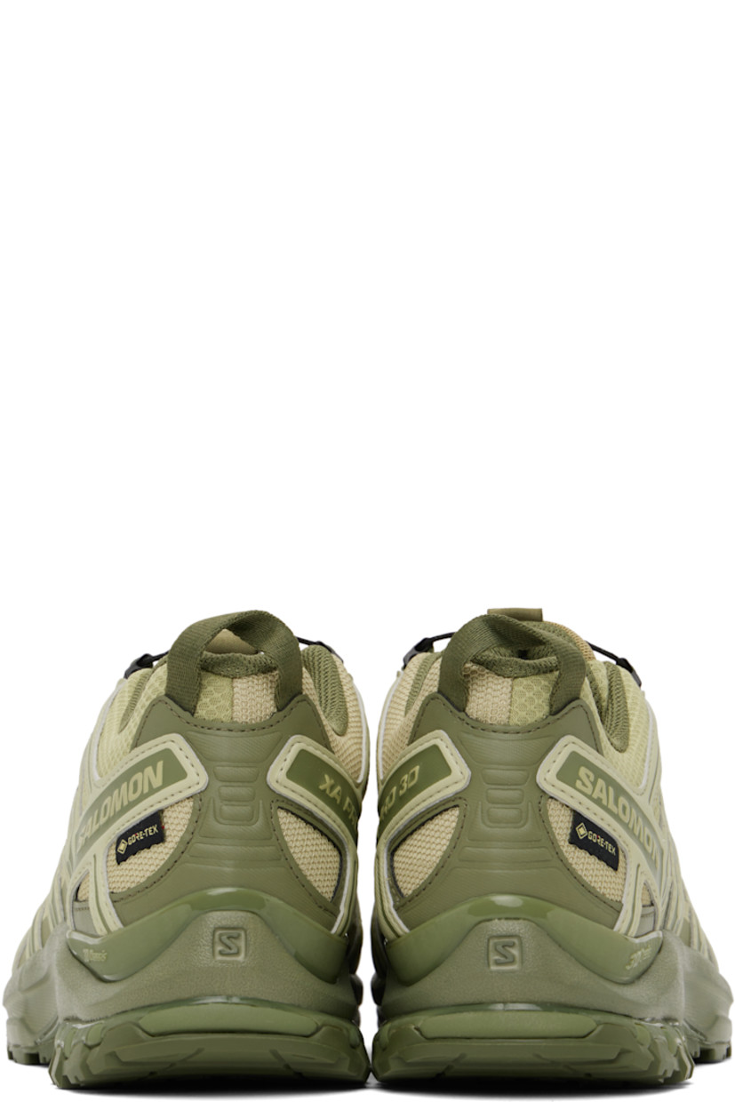 Low-top mesh and buffed faux-leather sneakers in green.

· Certified OEKO-Tex® Standard and Bluesign® 
· GORE-TEX™ ePE waterproof membrane, PFC-free
· Quicklace™ closure
· Logo-woven pull-loop at tongue
· Logo patch at padded tongue
· Padded collar
· Reflective trim and logo flag at outer side
· Logo and text embossed at sides and heel
· Pull-loop at heel tab
· Molded OrthoLite® footbed
· 3D Advanced Chassis™ foam rubber midsole
· Treaded All Terrain Contagrip® rubber outsole

Supplier color: Gray green/Alfalfa/Deep lichen green