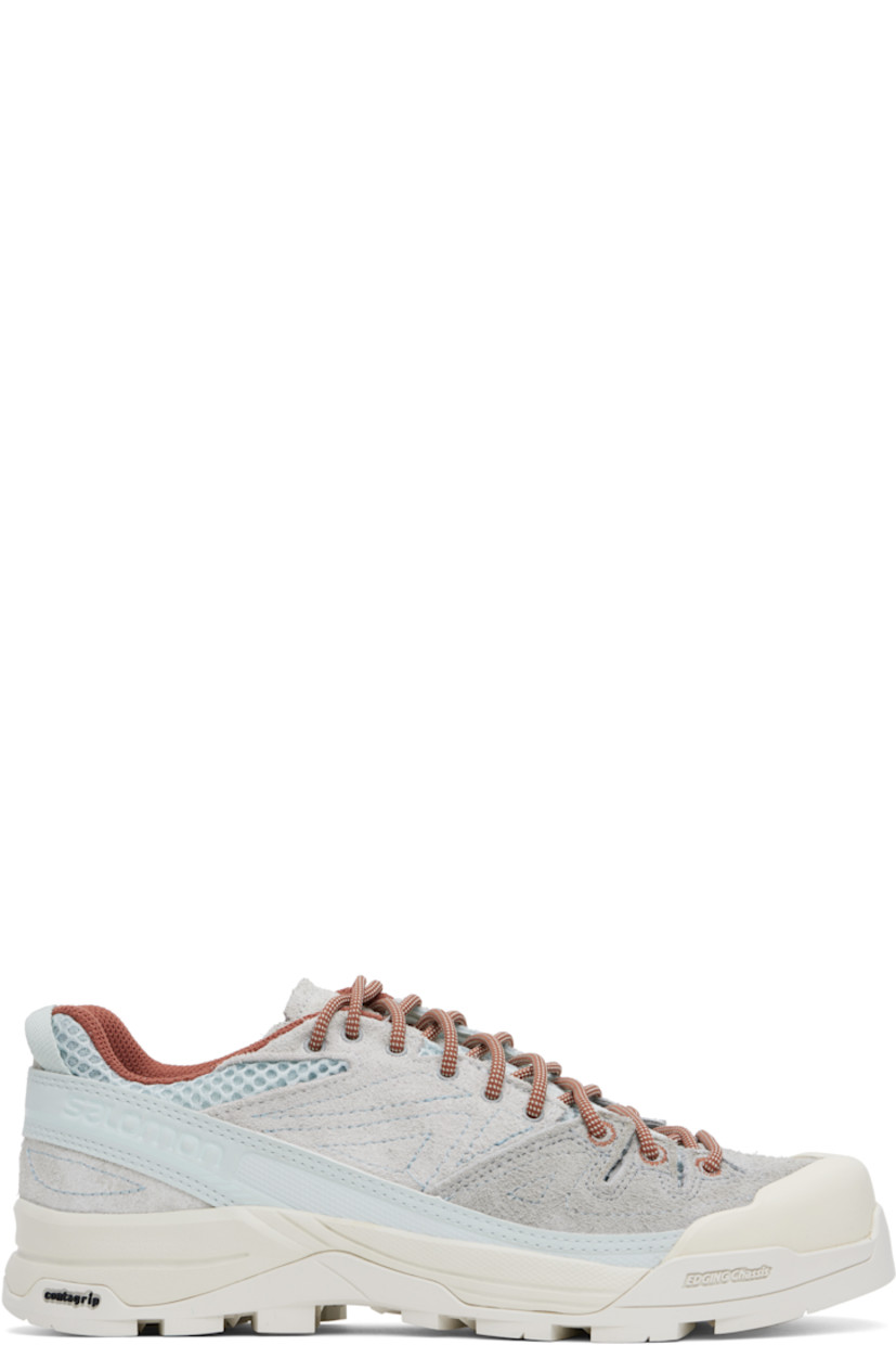 Low-top mesh and suede sneakers in gray and blue.

· Rubber cap toe
· Lace-up closure
· Logo printed at padded tongue
· Padded collar
· Logo embossed at outer side
· Pull-loop with reflective logo at heel
· Cushioned Ortholite® insole
· Mesh lining
· 3D Edging Chassis™ rubber midsole
· Treaded Contagrip® rubber sole

Supplier color: Ice flow/Quarry/Russet