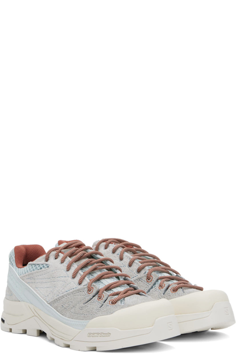 Low-top mesh and suede sneakers in gray and blue.

· Rubber cap toe
· Lace-up closure
· Logo printed at padded tongue
· Padded collar
· Logo embossed at outer side
· Pull-loop with reflective logo at heel
· Cushioned Ortholite® insole
· Mesh lining
· 3D Edging Chassis™ rubber midsole
· Treaded Contagrip® rubber sole

Supplier color: Ice flow/Quarry/Russet