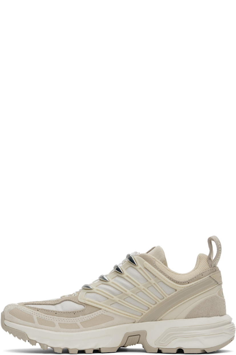 Low-top canvas, suede, and anti-debris sensiFIT™ mesh sneakers in beige.

· Rubberized trim throughout
· Logo printed at toe and outer side
· Quicklace™ closure
· Logo patch at vamp and padded tongue
· Padded collar
· Logo-bonded pull-loops at heel tab
· Logo embroidered at outer side
· Logo embossed at heel counter
· Mesh lining
· Molded OrthoLite® footbed
· Agile Chassis™ System at foam rubber midsole
· Treaded All Terrain Contagrip® rubber sole

Supplier color: Oxford tan/Rainy day/Vanilla ice