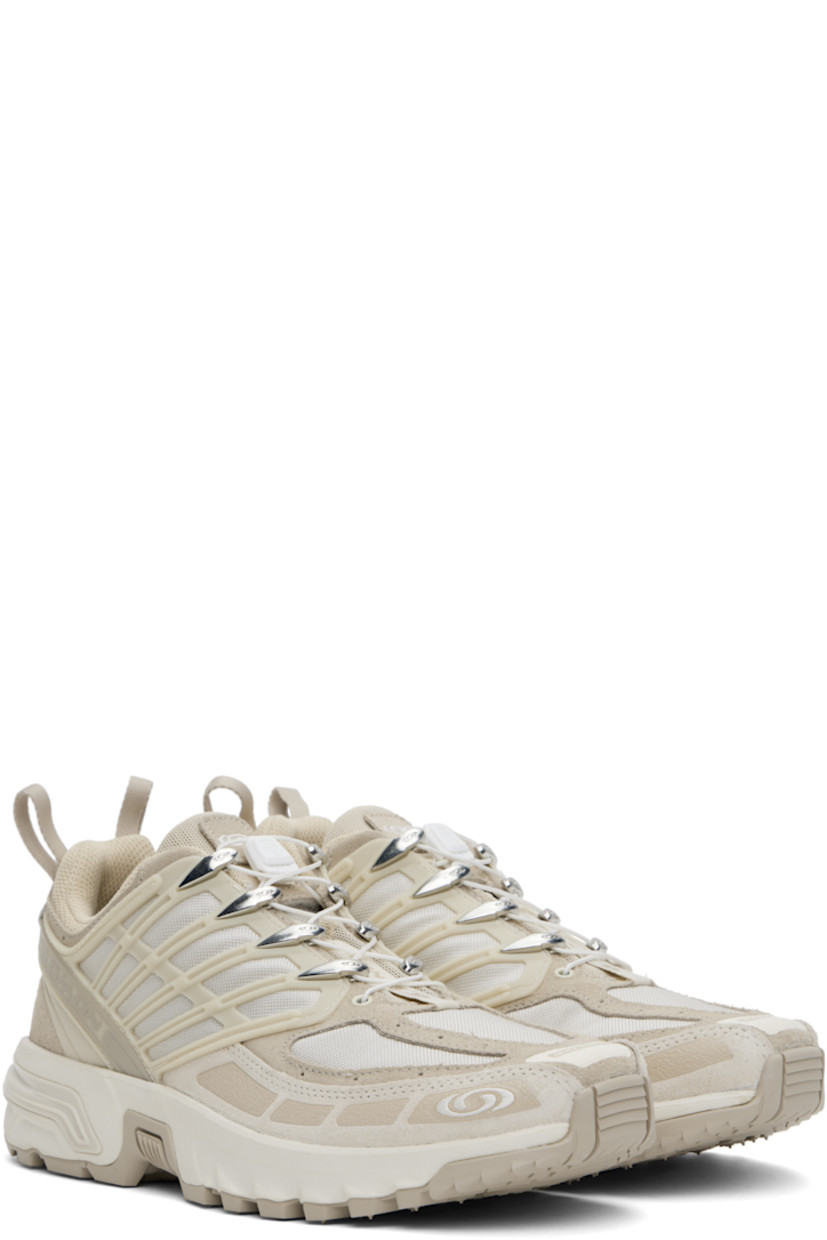 Low-top canvas, suede, and anti-debris sensiFIT™ mesh sneakers in beige.

· Rubberized trim throughout
· Logo printed at toe and outer side
· Quicklace™ closure
· Logo patch at vamp and padded tongue
· Padded collar
· Logo-bonded pull-loops at heel tab
· Logo embroidered at outer side
· Logo embossed at heel counter
· Mesh lining
· Molded OrthoLite® footbed
· Agile Chassis™ System at foam rubber midsole
· Treaded All Terrain Contagrip® rubber sole

Supplier color: Oxford tan/Rainy day/Vanilla ice