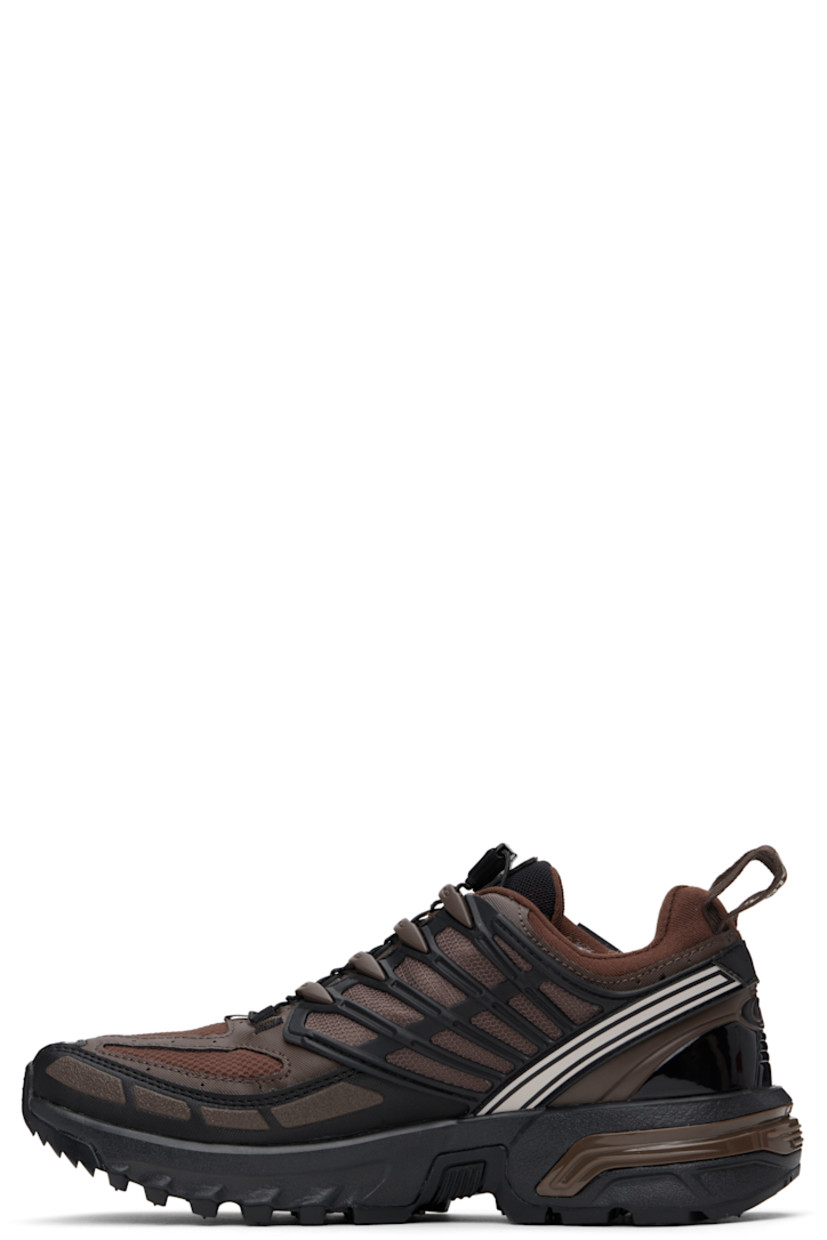 Low-top faux-leather and mesh sneakers in brown. 

· Certified OEKO-Tex® Standard and Bluesign®
· GORE-TEX™ ePE waterproof membrane, PFC-free
· Rubberized trim and bonded logos throughout
· Quicklace® closure
· Logo patch at padded tongue
· Padded collar
· SensiFit™ and sheer mesh panel at sides
· Pull-loops at heel tab
· Logo embossed at heel counter
· Molded OrthoLite® insole
· Jersey lining
· Agile Chassis™ System at rubber EnergyCell midsole
· Treaded All Terrain Contagrip® rubber sole

Supplier color: Roasted clay/Black/Rum raisin