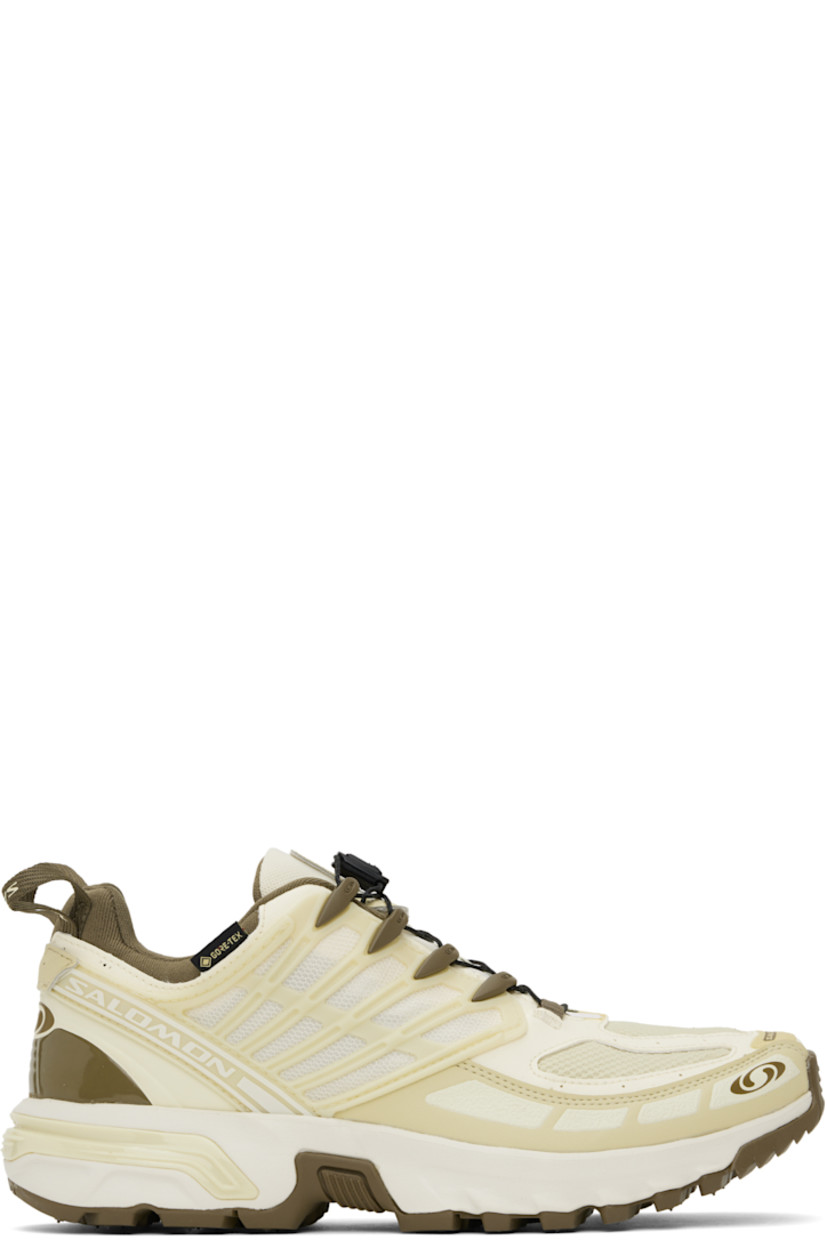 Low-top faux-leather and mesh sneakers in yellow and brown.

· Certified OEKO-Tex® Standard and Bluesign® 
· GORE-TEX™ waterproof membrane, PFC-free
· Rubberized trim and logos bonded throughout
· Quicklace® closure
· Velcro tab and logo patch at padded tongue
· Padded collar
· Logo flag at outer side
· Mesh panel at sides
· Pull-loops at heel tab
· OrthoLite® insole
· Jersey lining
· Agile Chassis™ System at rubber midsole
· Treaded Contagrip® rubber sole

Supplier color: Vanilla ice/Green haze/Stone gray