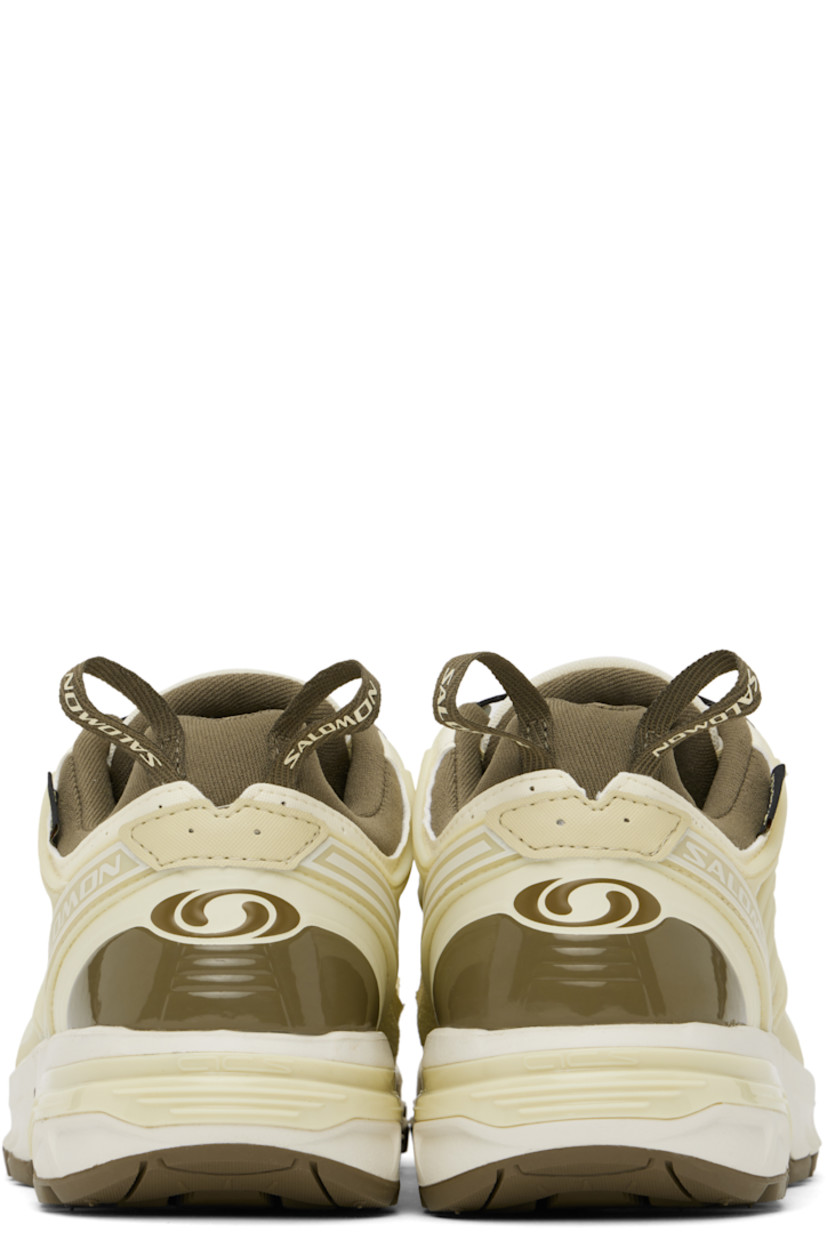 Low-top faux-leather and mesh sneakers in yellow and brown.

· Certified OEKO-Tex® Standard and Bluesign® 
· GORE-TEX™ waterproof membrane, PFC-free
· Rubberized trim and logos bonded throughout
· Quicklace® closure
· Velcro tab and logo patch at padded tongue
· Padded collar
· Logo flag at outer side
· Mesh panel at sides
· Pull-loops at heel tab
· OrthoLite® insole
· Jersey lining
· Agile Chassis™ System at rubber midsole
· Treaded Contagrip® rubber sole

Supplier color: Vanilla ice/Green haze/Stone gray