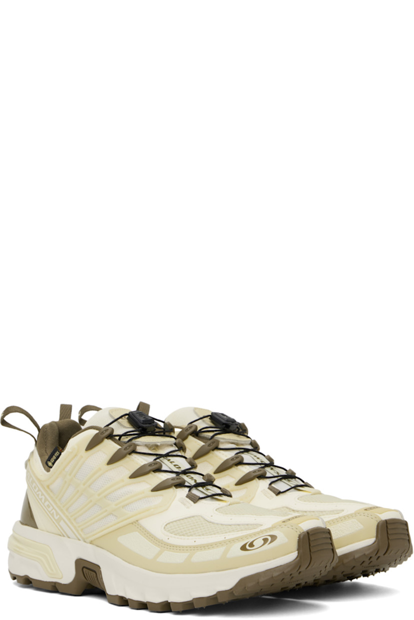 Low-top faux-leather and mesh sneakers in yellow and brown.

· Certified OEKO-Tex® Standard and Bluesign® 
· GORE-TEX™ waterproof membrane, PFC-free
· Rubberized trim and logos bonded throughout
· Quicklace® closure
· Velcro tab and logo patch at padded tongue
· Padded collar
· Logo flag at outer side
· Mesh panel at sides
· Pull-loops at heel tab
· OrthoLite® insole
· Jersey lining
· Agile Chassis™ System at rubber midsole
· Treaded Contagrip® rubber sole

Supplier color: Vanilla ice/Green haze/Stone gray
