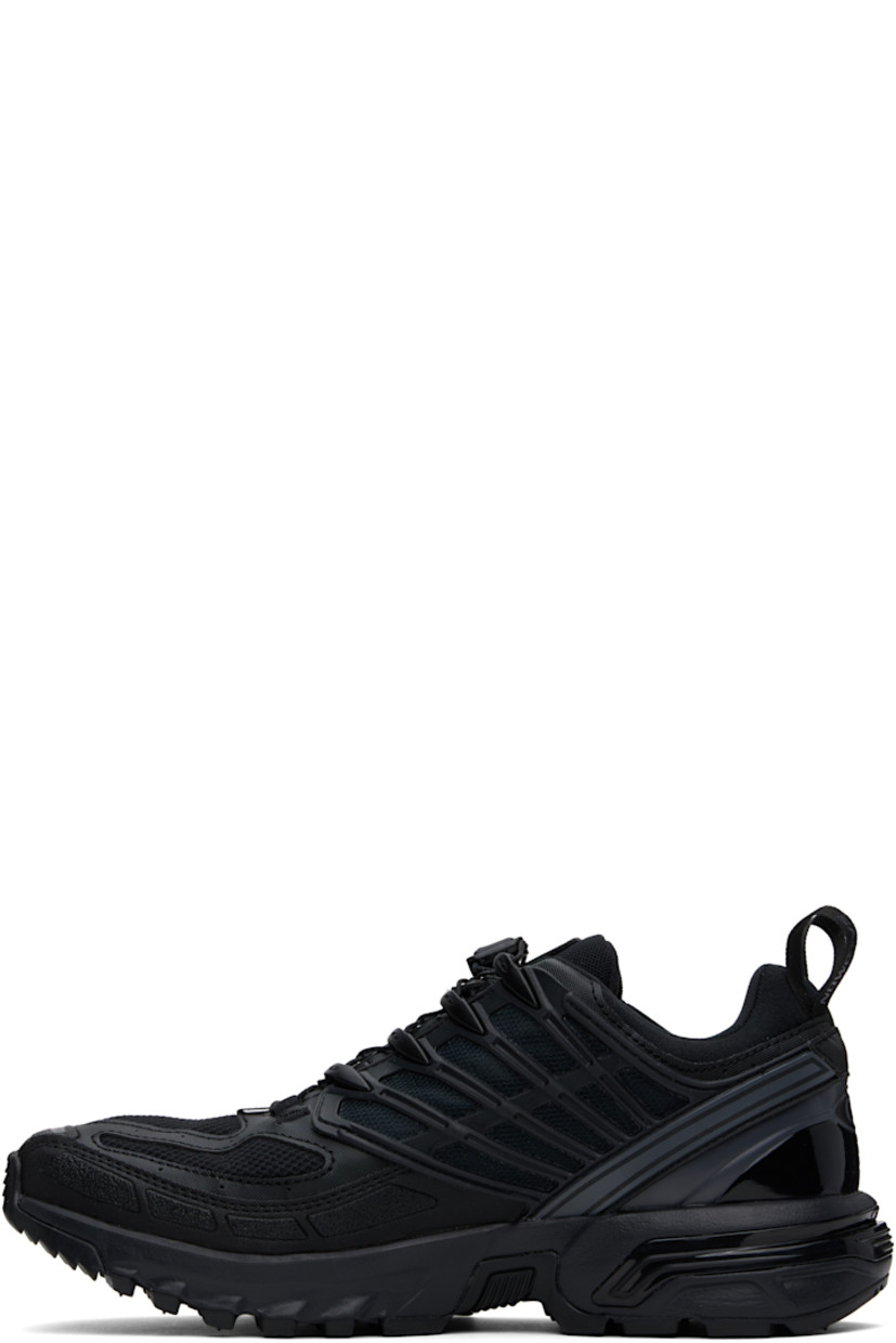 Low-top GORE-TEX™ mesh and textured faux-leather sneakers in black.

· Waterproof and anti-debris
· Rubberized trim throughout
· Logos bonded at toe
· Quicklace™ closure
· Logo patch at vamp
· Velcro tab and logo patch at padded tongue
· Padded collar
· SensiFit™ panel at sides
· Printed logo and logo flag at outer side
· Logo-bonded pull-loops at heel tab
· Logo embossed at heel counter
· Cushioned OrthoLite® insole
· Jersey and mesh lining
· Foam rubber EnergyCell midsole
· Agile Chassis™ Skeleton at midsole
· Treaded Mud Contagrip® rubber sole

Supplier color: Black/Black/Asphalt