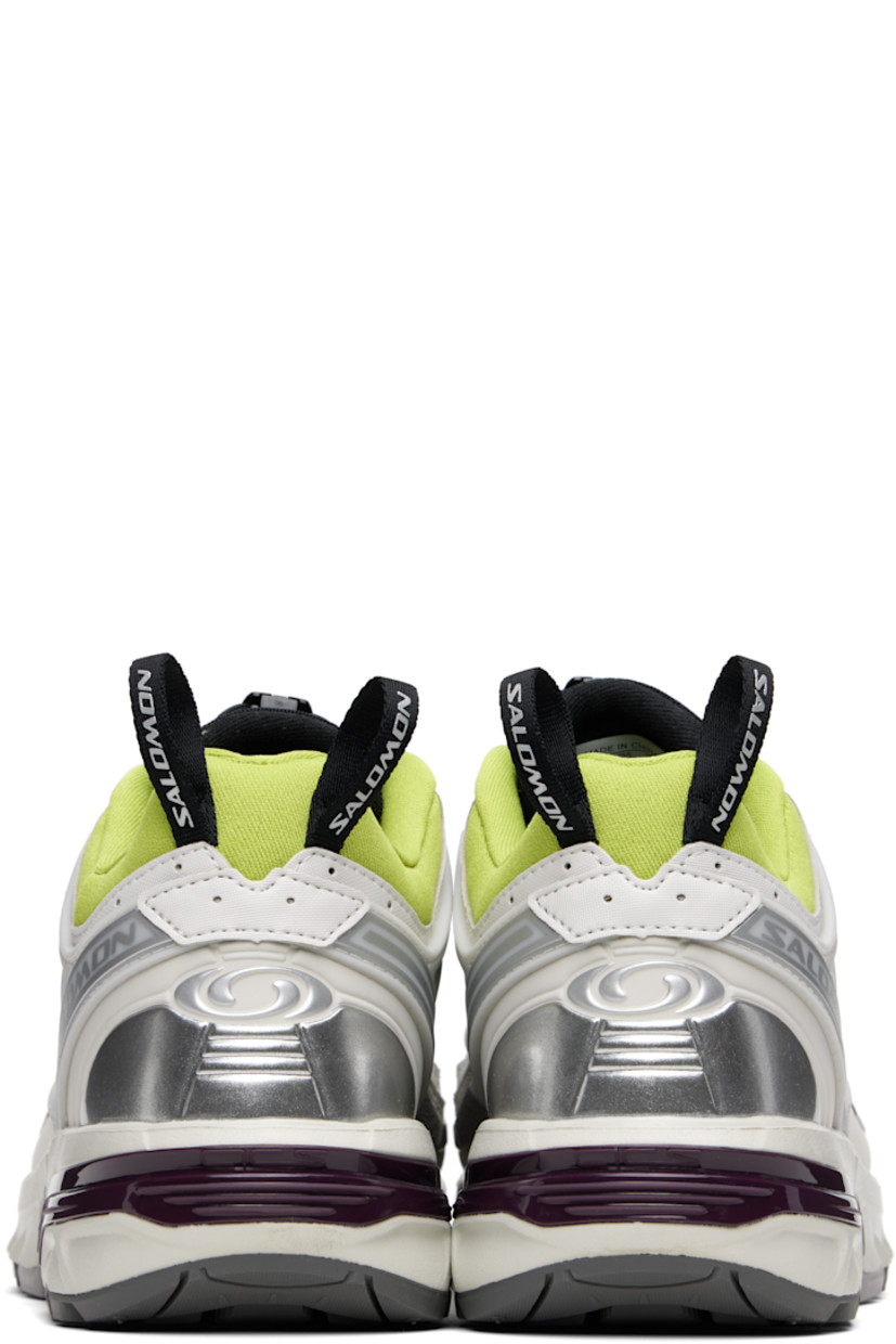 Low-top textured faux-leather and mesh sneakers in gray.

· Rubberized trim throughout
· Logo printed at toe and outer side
· Quicklace® closure
· Logo patch at padded tongue
· Padded collar
· sensiFIT™ and sheer mesh panel at sides
· Logo-bonded pull-loops at heel tab
· Logo embossed at heel counter
· Molded OrthoLite® insole
· Jersey lining
· Agile Chassis™ System at rubber EnergyCell midsole
· Treaded All Terrain Contagrip® rubber sole

Supplier color: Lunar rock/Plum perfect/Dark citron