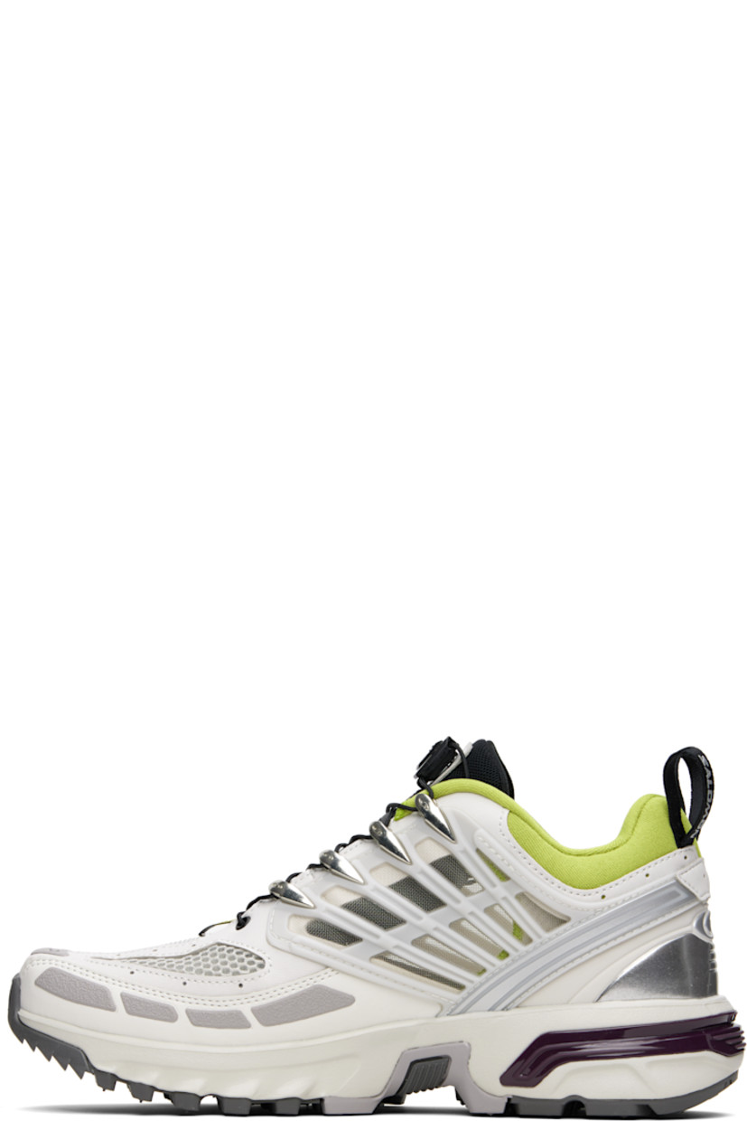 Low-top textured faux-leather and mesh sneakers in gray.

· Rubberized trim throughout
· Logo printed at toe and outer side
· Quicklace® closure
· Logo patch at padded tongue
· Padded collar
· sensiFIT™ and sheer mesh panel at sides
· Logo-bonded pull-loops at heel tab
· Logo embossed at heel counter
· Molded OrthoLite® insole
· Jersey lining
· Agile Chassis™ System at rubber EnergyCell midsole
· Treaded All Terrain Contagrip® rubber sole

Supplier color: Lunar rock/Plum perfect/Dark citron