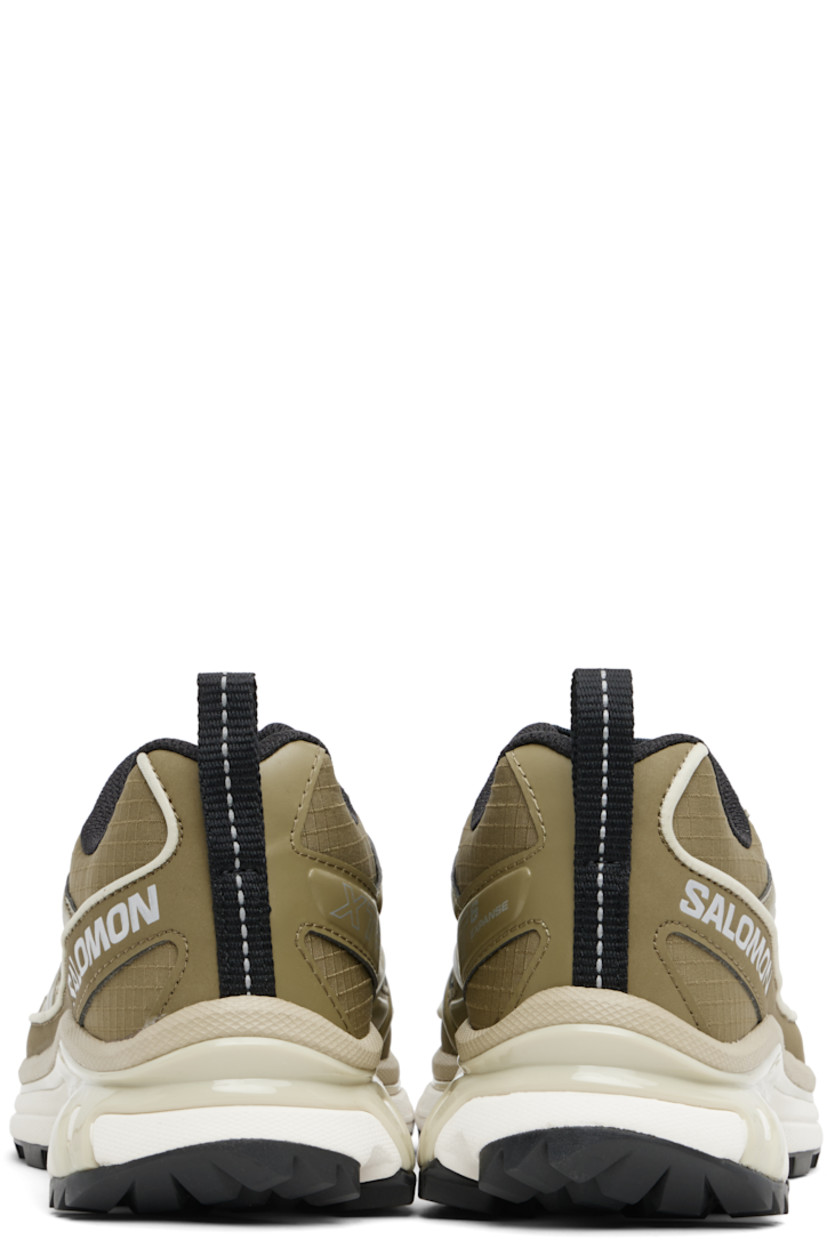 Low-top mesh and ripstop sneakers.

· Piping throughout
· Logo embossed at toe
· Lace-up closure
· Logo patch at vamp and tongue
· Padded collar
· Reflective pull-loop at heel tab
 · sensiFIT™ panel at sides
· Text printed at inner side
· Logo embossed at outer side
· Molded OrthoLite® insole
· EndoFit™ mesh lining
· Agile Chassis™ System at EnergyCell midsole
· Treaded Mud Contagrip® rubber sole

Supplier color: Martini Olive/Olive Night/Ftw Silver