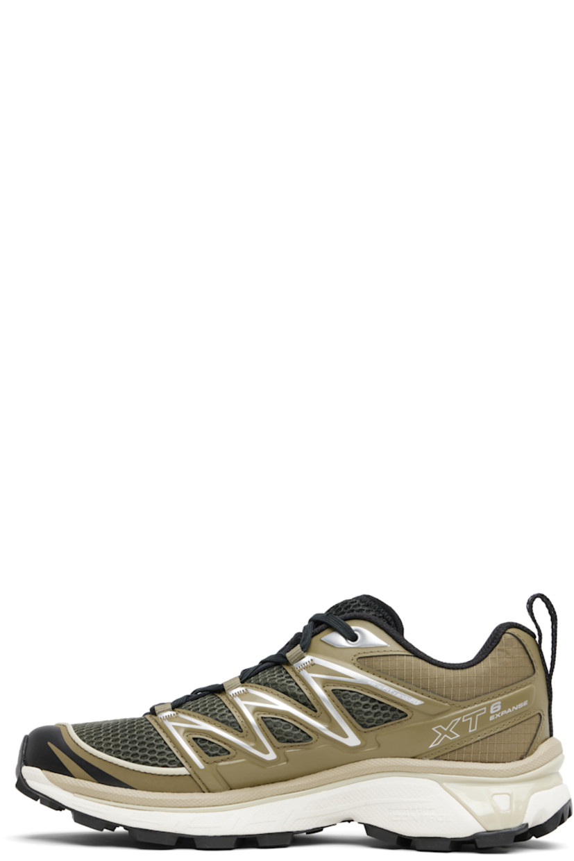 Low-top mesh and ripstop sneakers.

· Piping throughout
· Logo embossed at toe
· Lace-up closure
· Logo patch at vamp and tongue
· Padded collar
· Reflective pull-loop at heel tab
 · sensiFIT™ panel at sides
· Text printed at inner side
· Logo embossed at outer side
· Molded OrthoLite® insole
· EndoFit™ mesh lining
· Agile Chassis™ System at EnergyCell midsole
· Treaded Mud Contagrip® rubber sole

Supplier color: Martini Olive/Olive Night/Ftw Silver
