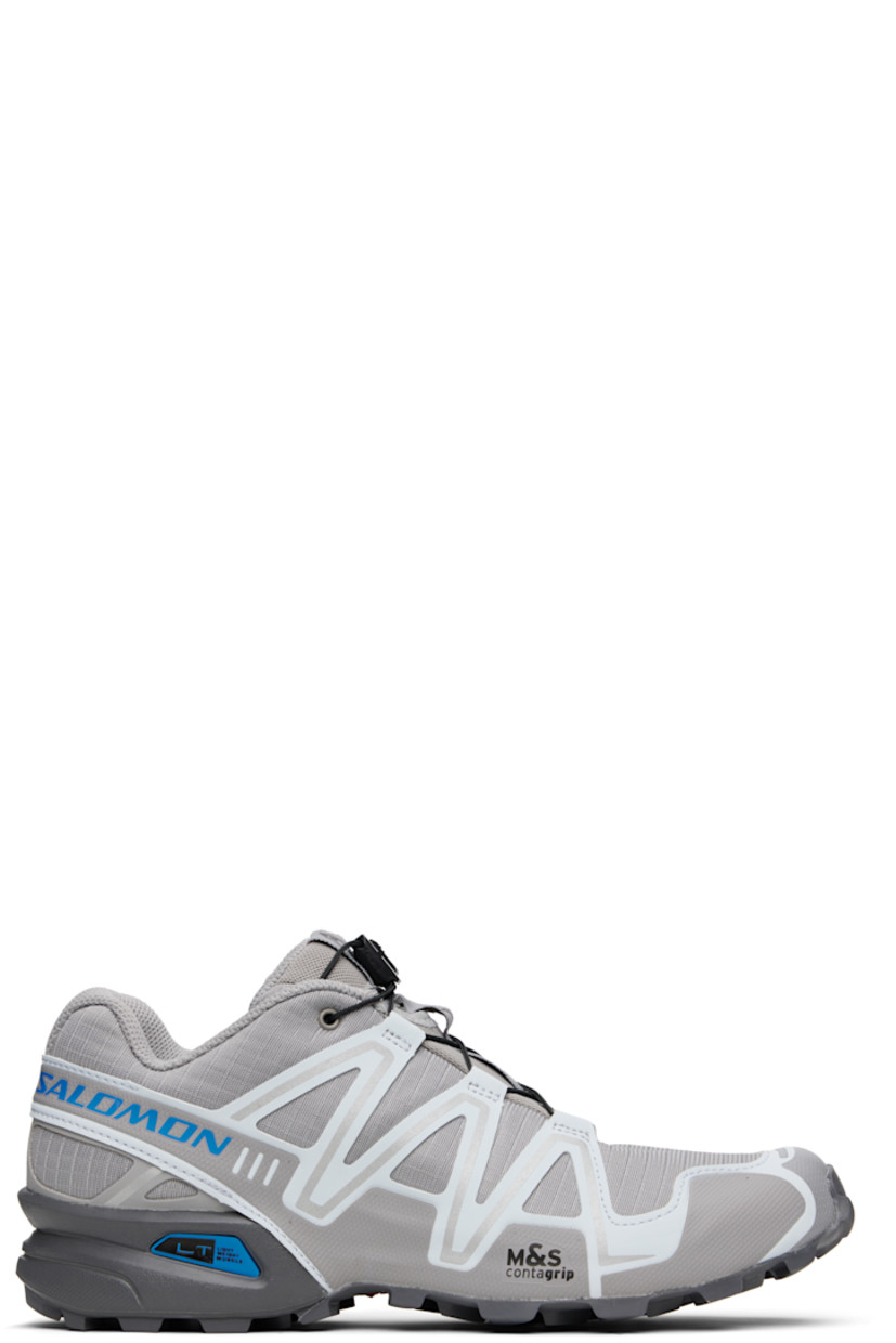 Low-top mesh and buffed faux-leather sneakers in gray.

· Reflective trim throughout
· Quicklace™ closure
· Logo patch at vamp and tongue
· Padded tongue and collar
· Logo printed at outer side
· sensiFIT™ panel at sides
· Molded OrthoLite® footbed
· Mesh lining
· Foam rubber midsole
· Treaded Mud Contagrip® rubber sole

Supplier color: Alloy/Ballad blue/Castlerock