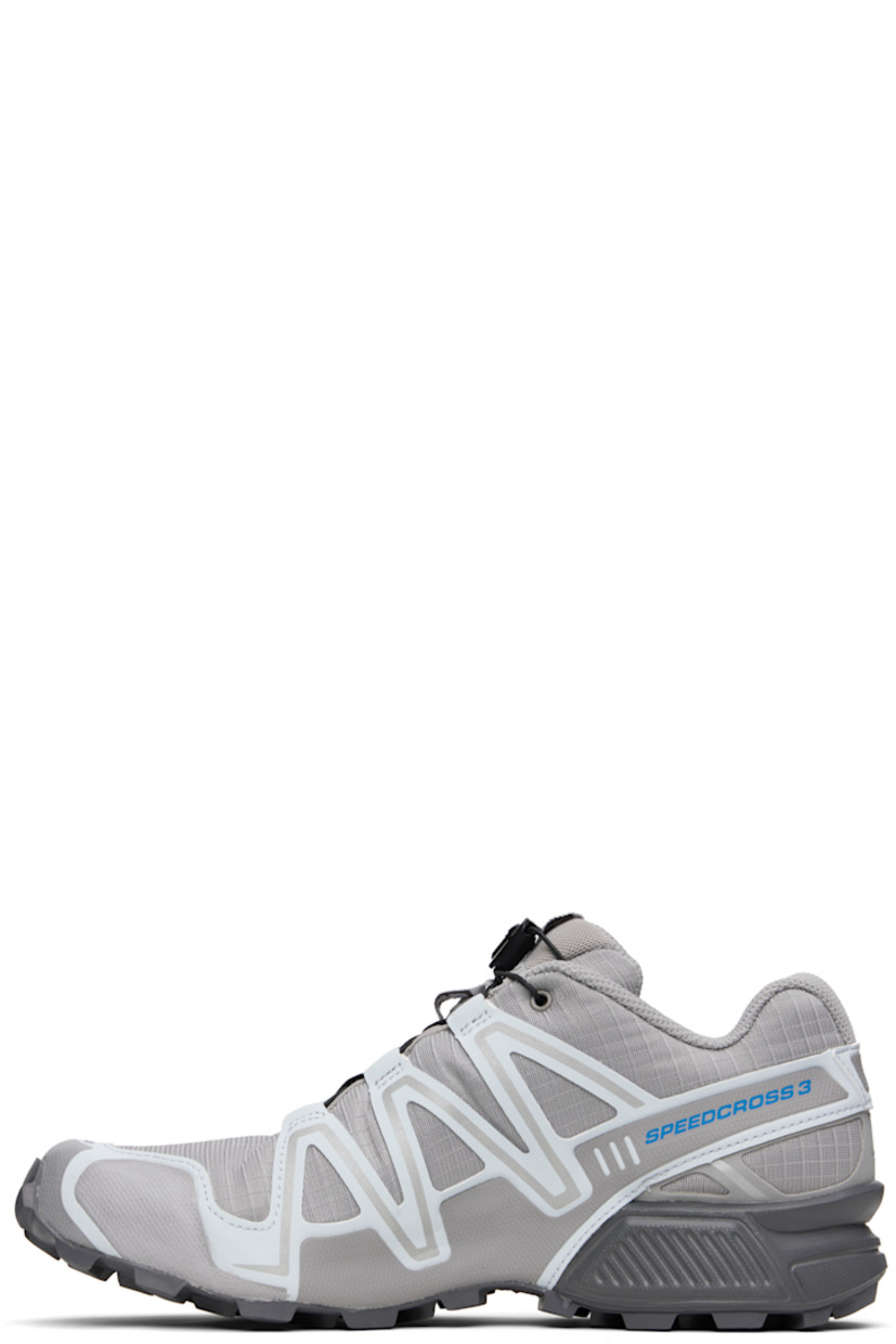Low-top mesh and buffed faux-leather sneakers in gray.

· Reflective trim throughout
· Quicklace™ closure
· Logo patch at vamp and tongue
· Padded tongue and collar
· Logo printed at outer side
· sensiFIT™ panel at sides
· Molded OrthoLite® footbed
· Mesh lining
· Foam rubber midsole
· Treaded Mud Contagrip® rubber sole

Supplier color: Alloy/Ballad blue/Castlerock