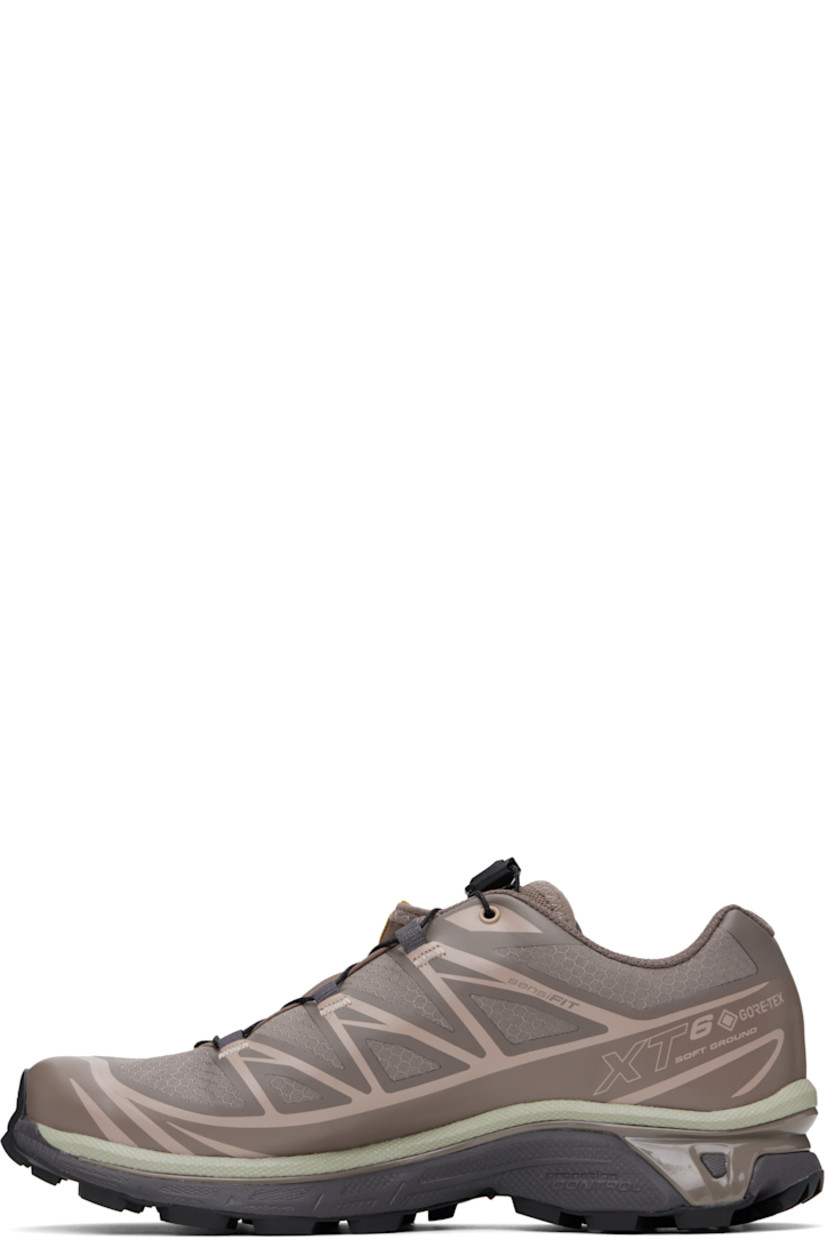 Low-top ripstop sneakers in taupe.

· GORE-TEX™ ePE waterproof membrane, PFC-free
· Bonded trim throughout
· Logo embossed at toe
· Quicklace™ closure
· Logo patch at vamp
· Logo-woven pull-loop at padded tongue
· Padded collar
· Bonded SensiFit™ panel at sides
· Logo printed at outer side
· Text printed at inner side
· Molded OrthoLite® insole
· Mesh lining
· Agile Chassis™ System at rubber EnergyCell midsole
· Treaded Mud Contagrip® rubber sole

Supplier color: Iron/Etherea/Seagrass
