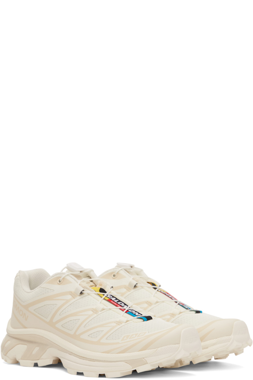 Low-top lightweight mesh sneakers in off-white.

· Quicklace™ closure
· Logo patch at vamp
· Logo-woven pull-loop at padded tongue
· Padded collar
· Logo and text printed at sides
· Bonded sensiFit™ panel at sides
· EndoFit™ mesh lining
· Molded OrthoLite® footbed
· Agile Chassis™ System at foam rubber EnergyCell midsole
· Treaded Mud Contagrip® rubber sole

Supplier color: Vanilla ice/Almond milk