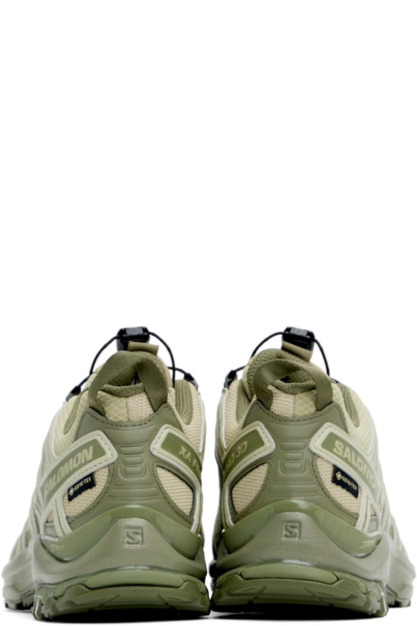 Low-top anti-debris mesh and buffed faux-leather sneakers in khaki.

· GORE-TEX™ ePE waterproof membrane, PFC-free
· Quicklace™ closure
· Logo-woven pull-loop at tongue
· Logo patch at padded tongue
· Padded collar
· Reflective trim and logo flag at outer side
· Logo and text embossed at sides and heel
· Pull-loop at heel tab
· Molded OrthoLite® footbed
· 3D Advanced Chassis™ foam rubber midsole
· Treaded All Terrain Contagrip® rubber outsole

Supplier color: Gray green/Alfalfa/Deep lichen green