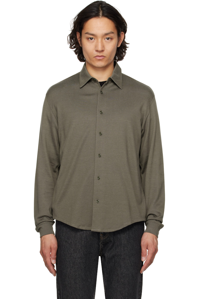 Preshrunk cotton-blend jersey shirt. 

· Spread collar
· Button closure
· Shirttail hem
· Dropped shoulders
· Box pleat at yoke
· Mother-of-pearl hardware

Supplier color: Grey olive