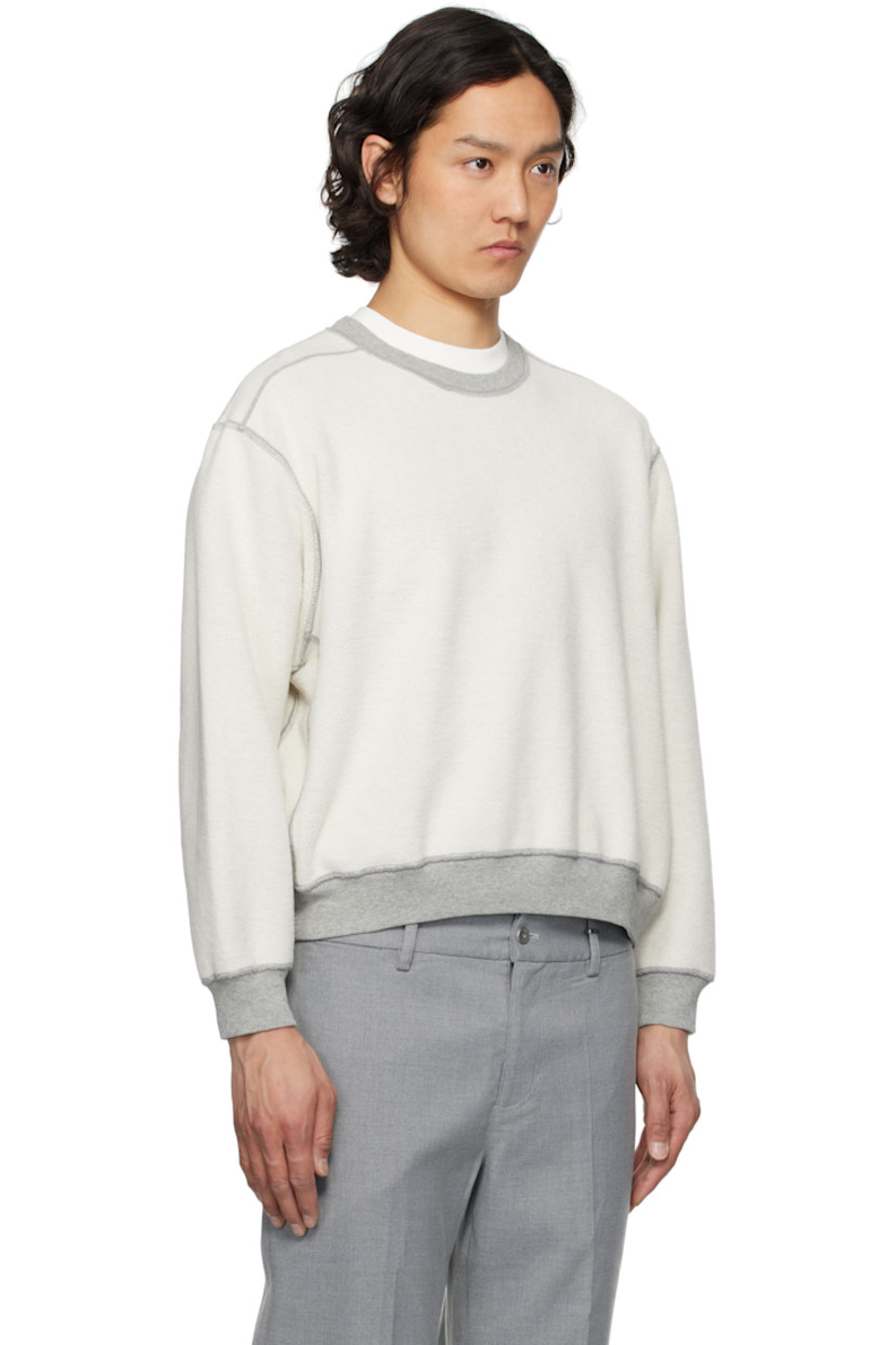 Reversible preshrunk 13 oz cotton fleece sweatshirt.

Reverse in gray cotton fleece.

· Boxy-fit
· Rib-knit crewneck, cropped hem, and cuffs
· Gusset at shoulders and side seams
· Dropped shoulders

Supplier color: Heather grey