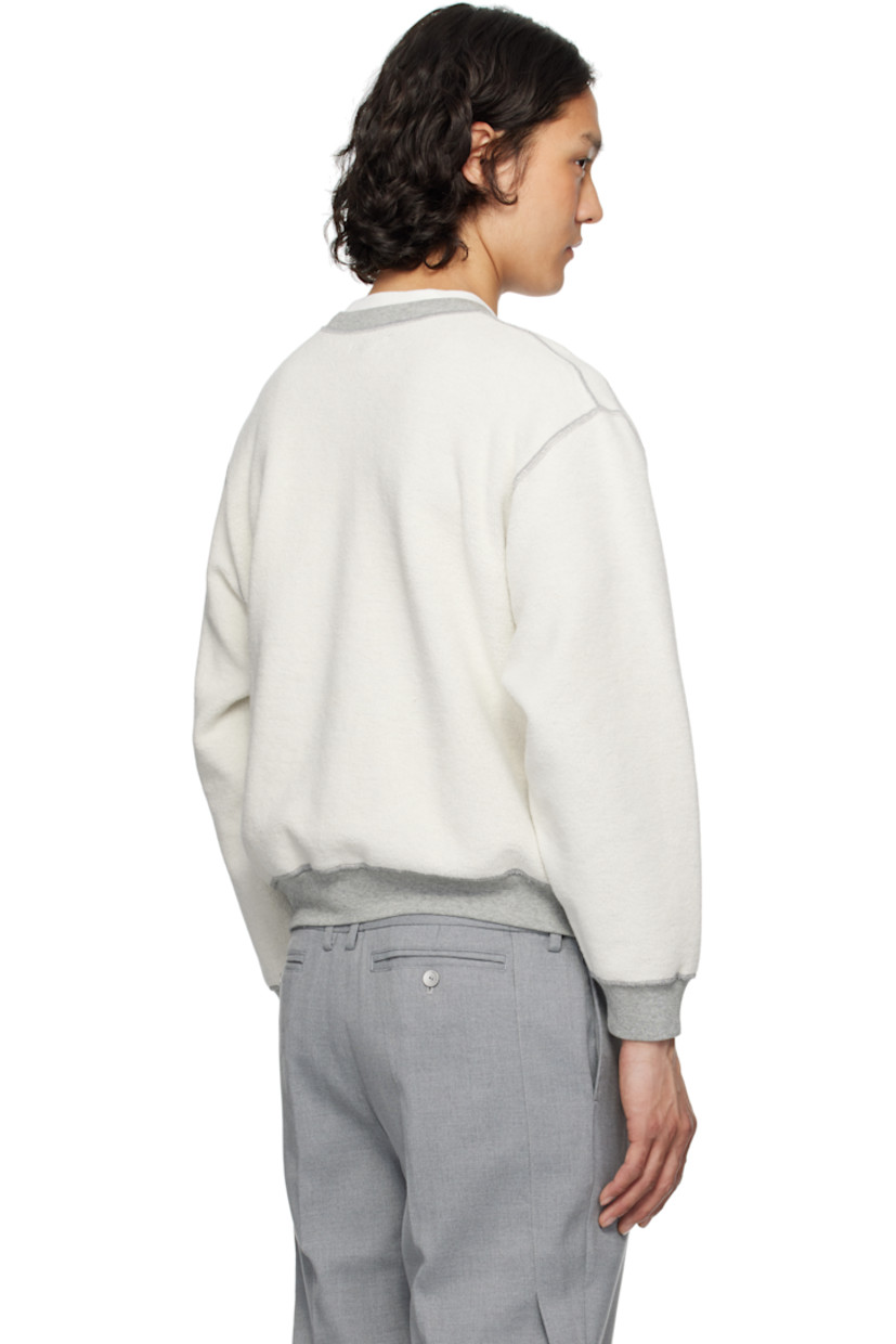 Reversible preshrunk 13 oz cotton fleece sweatshirt.

Reverse in gray cotton fleece.

· Boxy-fit
· Rib-knit crewneck, cropped hem, and cuffs
· Gusset at shoulders and side seams
· Dropped shoulders

Supplier color: Heather grey