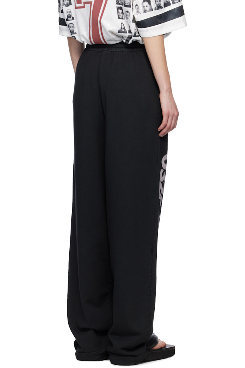 Organic cotton French terry lounge pants. Subtle distressing throughout. 

· Concealed drawstring at elasticized waistband
· Two-pocket styling
· Logo embroidered at front
· Logo and text printed at leg

Supplier color: Faded black