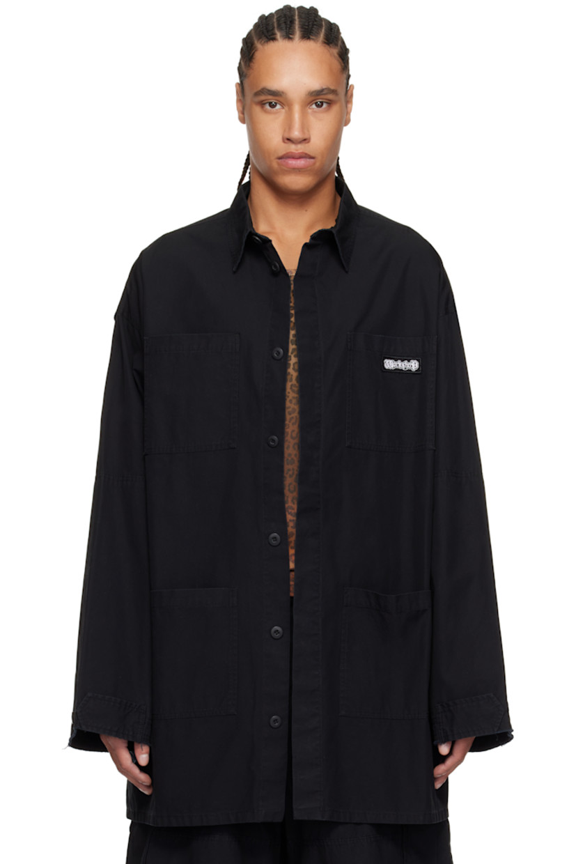 Cotton poplin overshirt.

· Spread collar
· Concealed button closure
· Logo patch at chest
· Patch pockets
· Vented side seams
· Dropped shoulders
· Raw edge at cuffs
· Adjustable button tab at cuffs
· Logo graphic printed at back

Supplier color: Black
