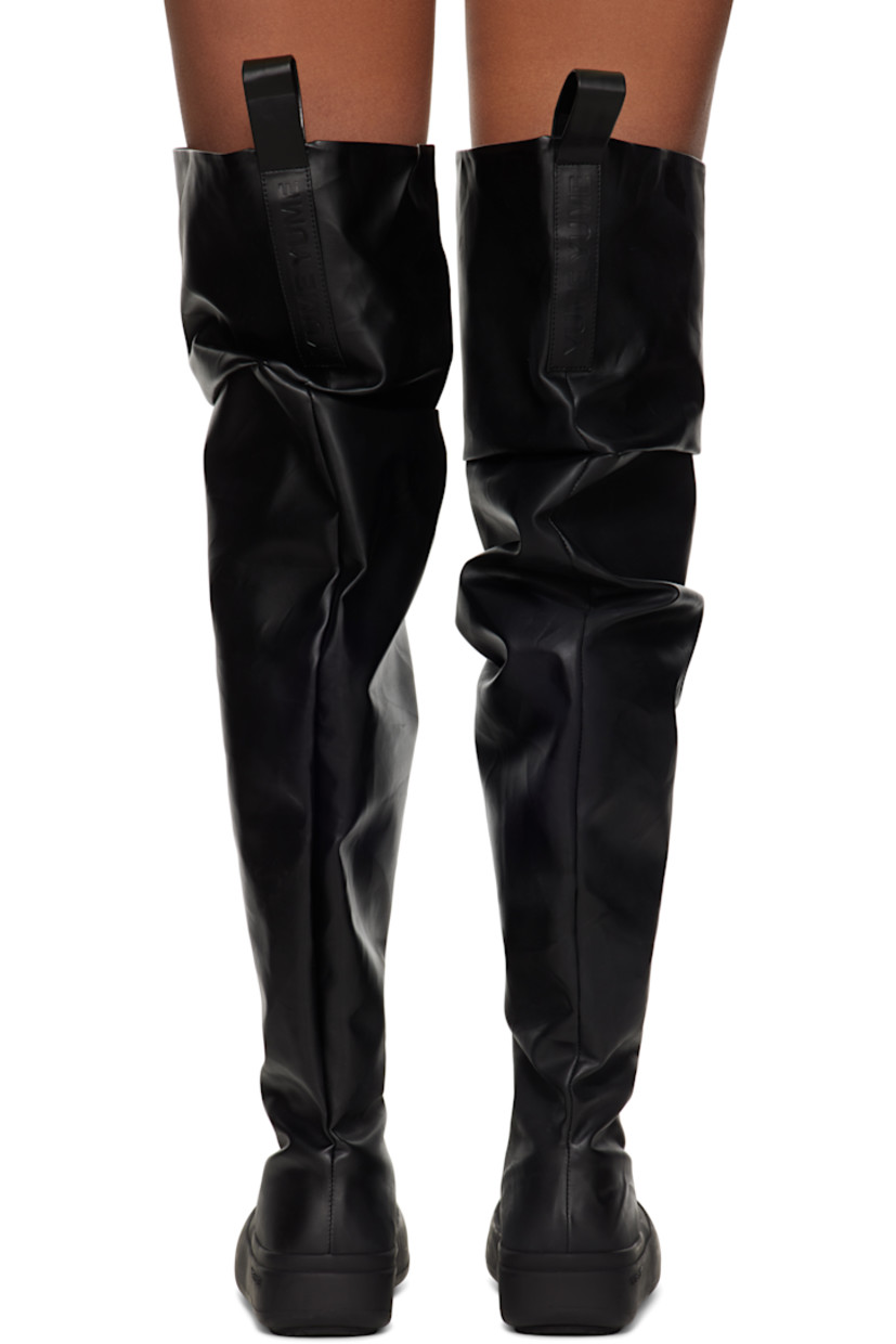 Thigh-high buffed faux-leather boots in black.

· Gathering throughout
· Logo-embossed pull-loops at collar
· Buffed faux-leather lining
· Rubberized trim at welt
· Logo embossed at midsole
· Treaded recycled rubber sole

Supplier color: Black