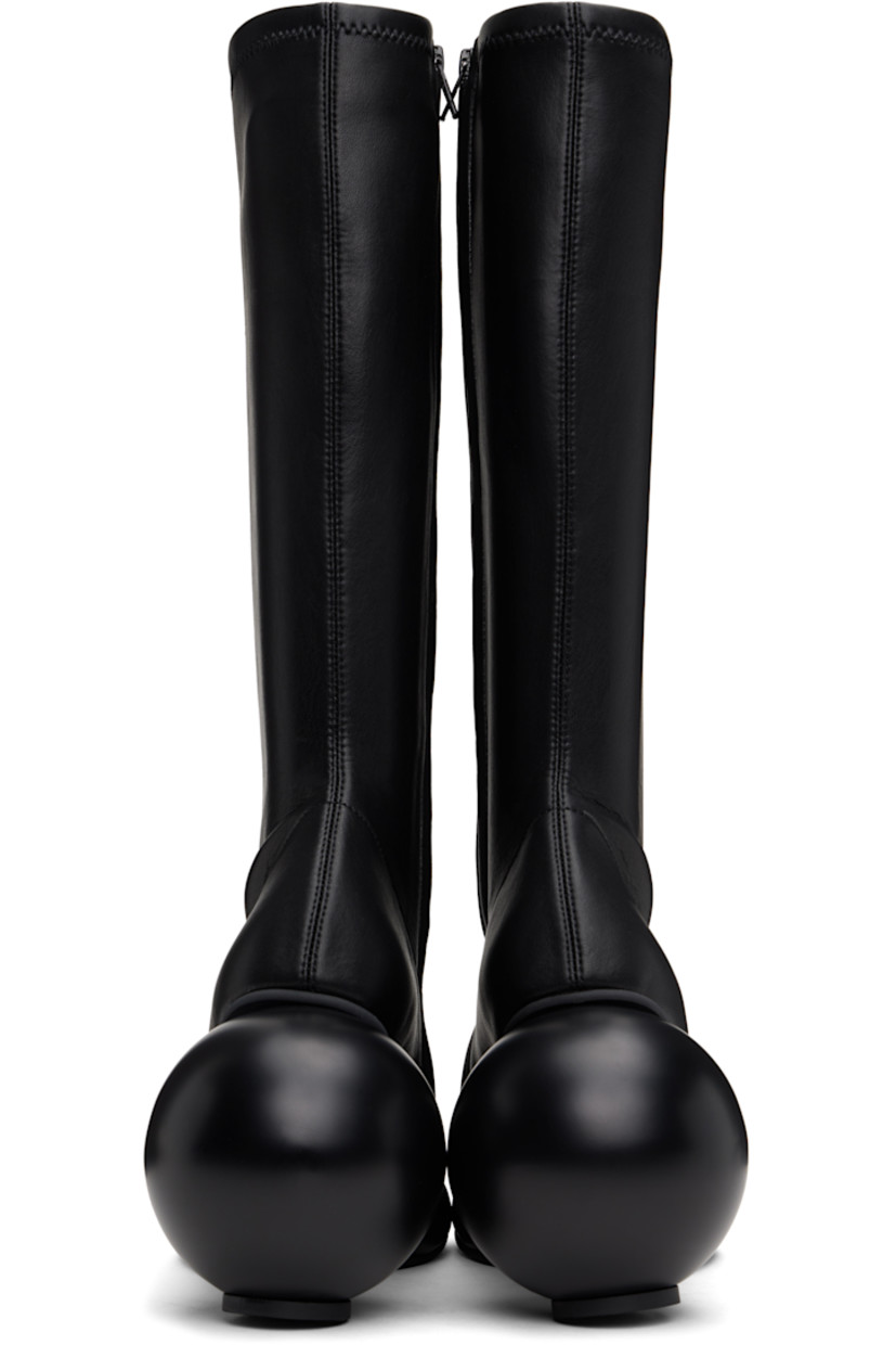 Knee-high grained faux-leather boots in black.

· Zip closure at inner side
· Sculptural heel with rubber injection
· Neolite rubber sole
· Heel: H3.75"

Supplier color: Black