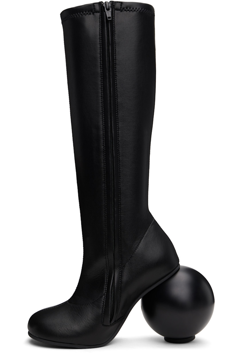 Knee-high grained faux-leather boots in black.

· Zip closure at inner side
· Sculptural heel with rubber injection
· Neolite rubber sole
· Heel: H3.75"

Supplier color: Black