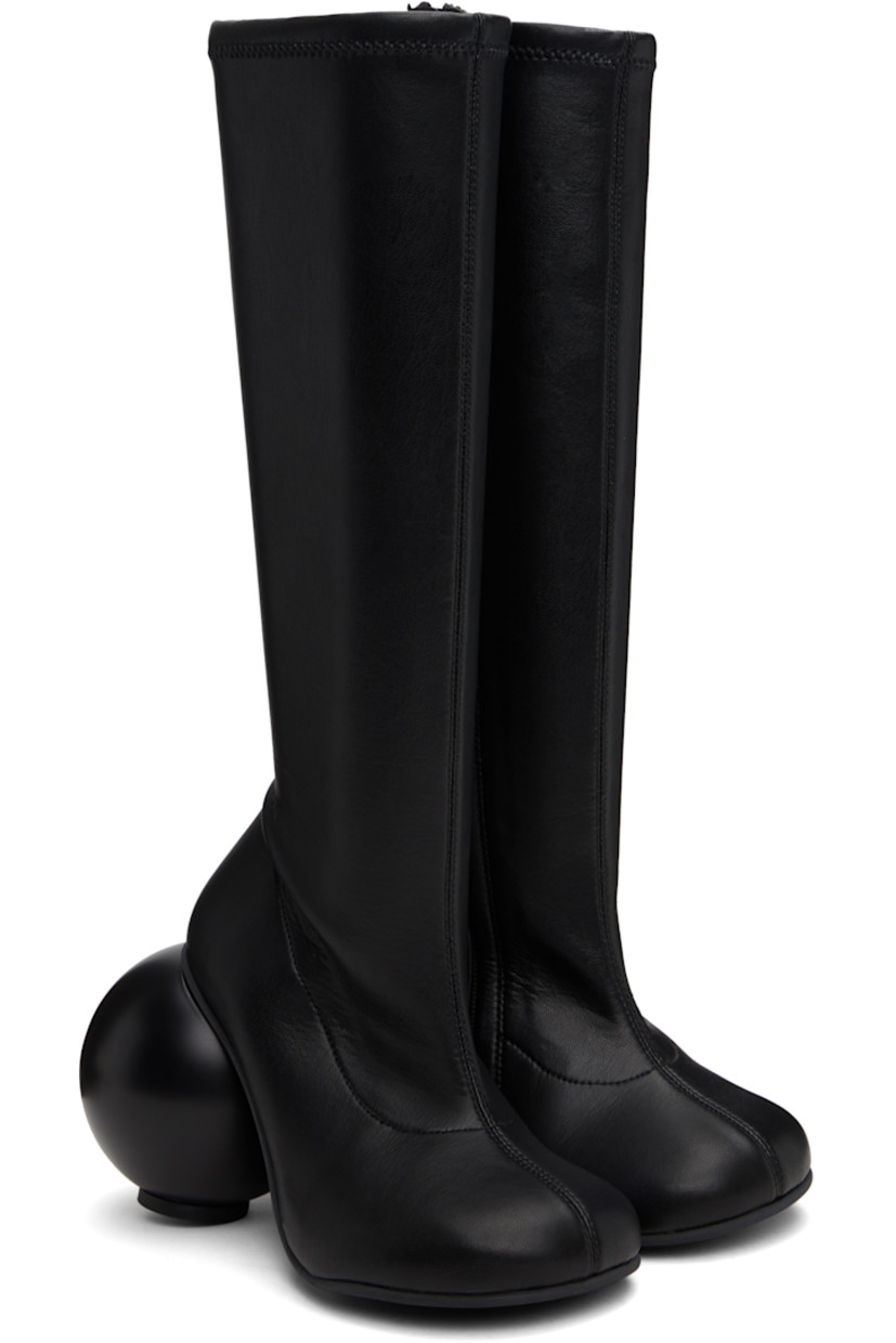 Knee-high grained faux-leather boots in black.

· Zip closure at inner side
· Sculptural heel with rubber injection
· Neolite rubber sole
· Heel: H3.75"

Supplier color: Black