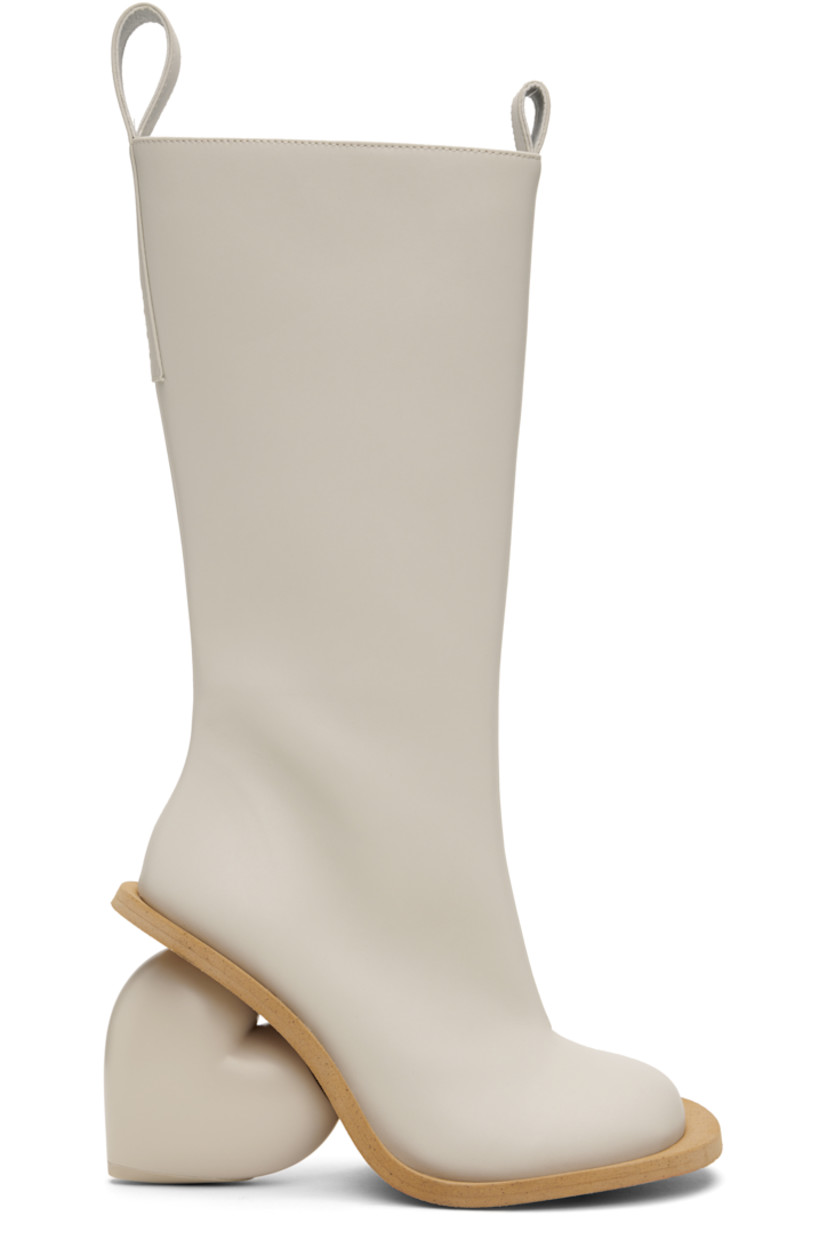 Knee-high buffed faux-leather boots in gray.

· Logo-embossed pull-loops at collar
· Zip closure at inner side
· Sculptural wedge heel with rubber injection
· Neolite rubber sole
· Heel: H3.75"

Supplier color: Rainday