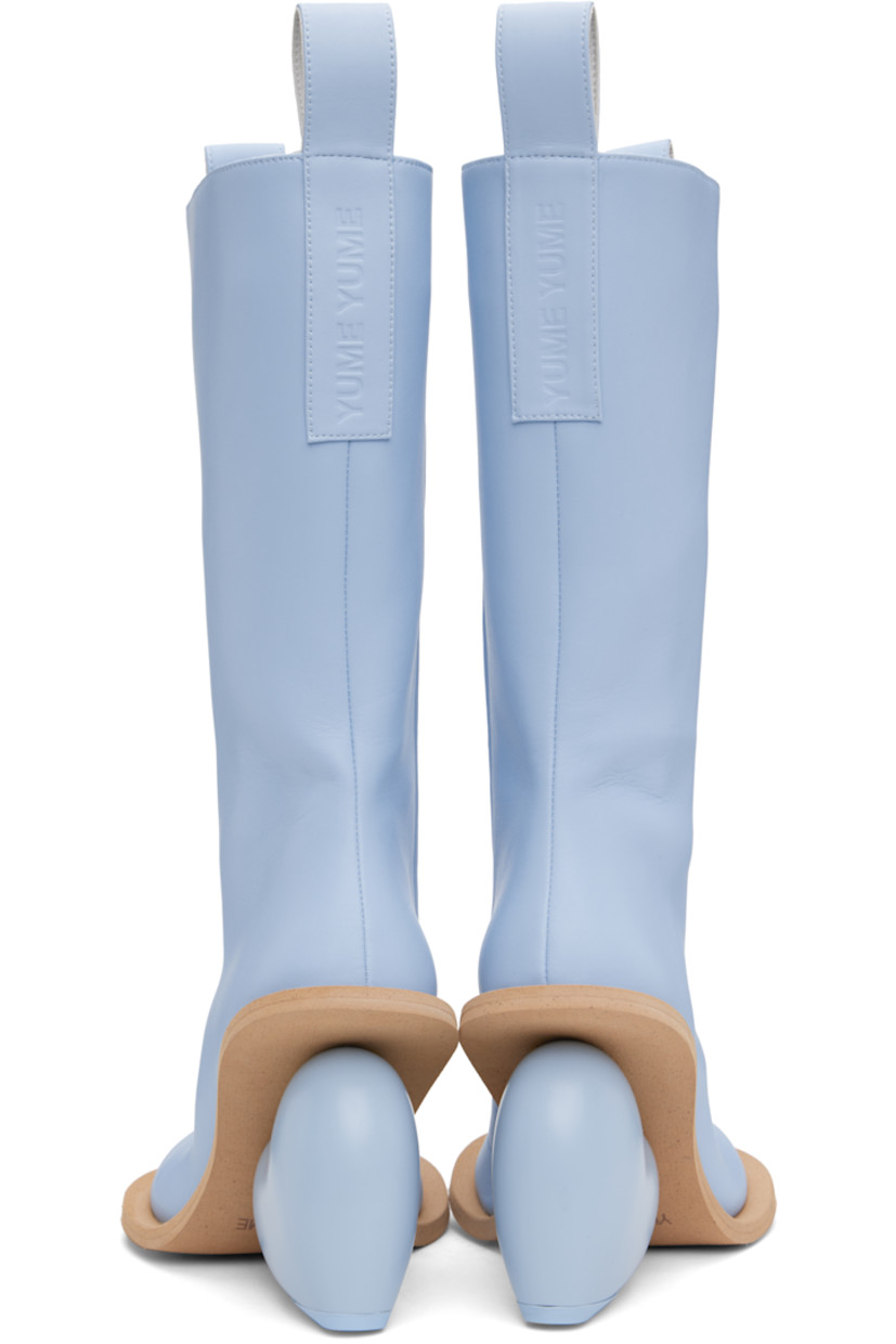Calf-high buffed faux-leather boots in blue.

· Pull-loops at collar
· Zip closure at inner side
· Logo embossed at heel tab
· Padded footbed
· Faux-nubuck lining
· Sculptural wedge heel with rubber injection
· Foam rubber sole
· Heel: H4" 

Supplier color: Lavanda