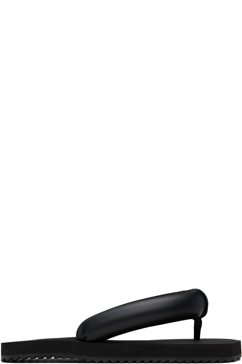 Padded buffed faux-leather flip-flops in black.

· Open square toe
· Thong-style strap at vamp
· Logo embossed at padded foam rubber footbed
· Treaded rubber sole

Supplier color: Black