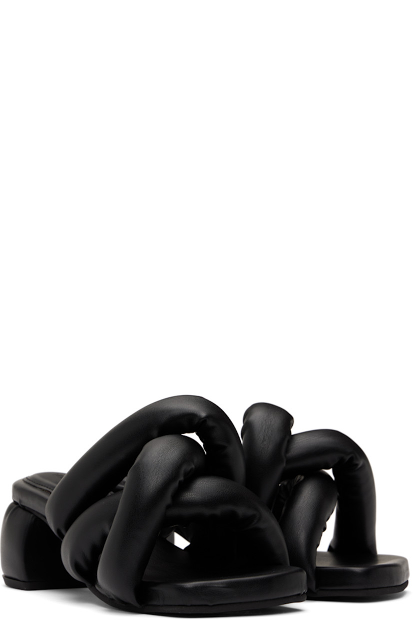 Padded buffed faux-leather slip-on heeled sandals in black.

· Open square toe
· Crisscrossing straps at vamp
· Logo-embossed padded footbed
· Covered block heel
· Treaded rubber sole
· Heel: H2.5"

Supplier color: Black