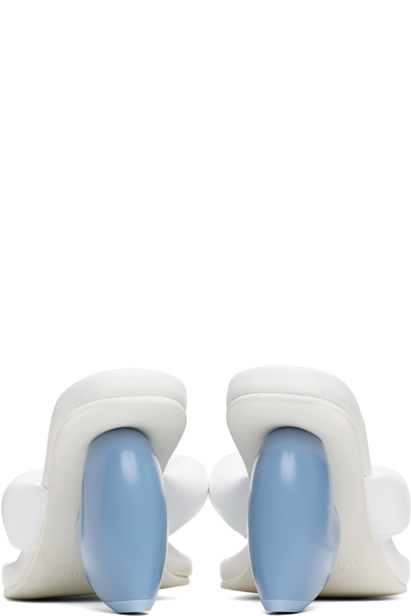Padded grained faux-leather heeled sandals in white.

· Open square toe
· Thong-style strap at vamp
· Logo stamp at padded footbed
· Sculptural wedge heel with rubber injection
· Treaded rubber sole
· Heel: H3.5"

Supplier color: Snow white/Blue