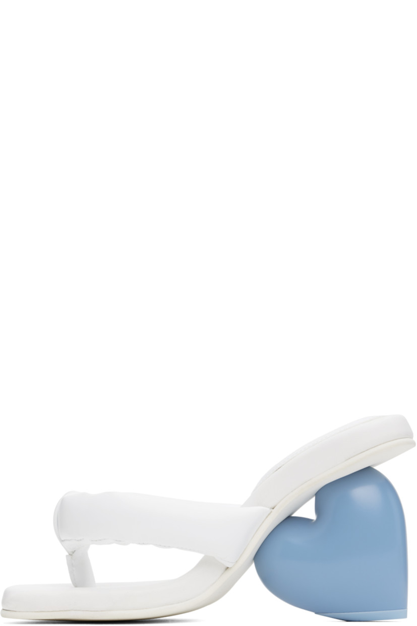 Padded grained faux-leather heeled sandals in white.

· Open square toe
· Thong-style strap at vamp
· Logo stamp at padded footbed
· Sculptural wedge heel with rubber injection
· Treaded rubber sole
· Heel: H3.5"

Supplier color: Snow white/Blue